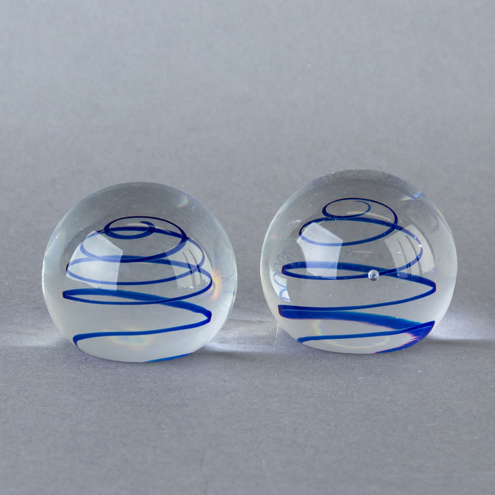 PAIR OF ART GLASS SPIRAL PAPERWEIGHTS: From a collection of Wedgwood and other selected ceramic/porcelain objects. Kindly examine all photographs provided in this listing or ask for a condition report. All items offered are in generally go