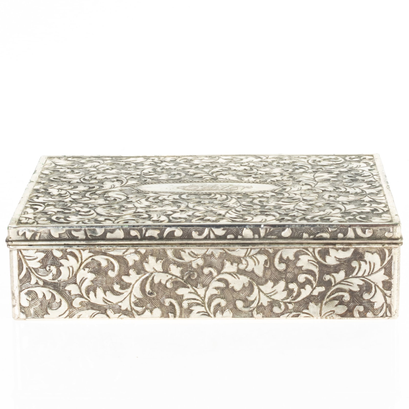 ENGRAVED & CHASED FOLIATE SILVER PLATED TOBACCO CIGARETTE BOX: From a collection of Wedgwood and other selected ceramic/porcelain objects. Kindly examine all photographs provided in this listing or ask for a condition report. All items offered are in generally go