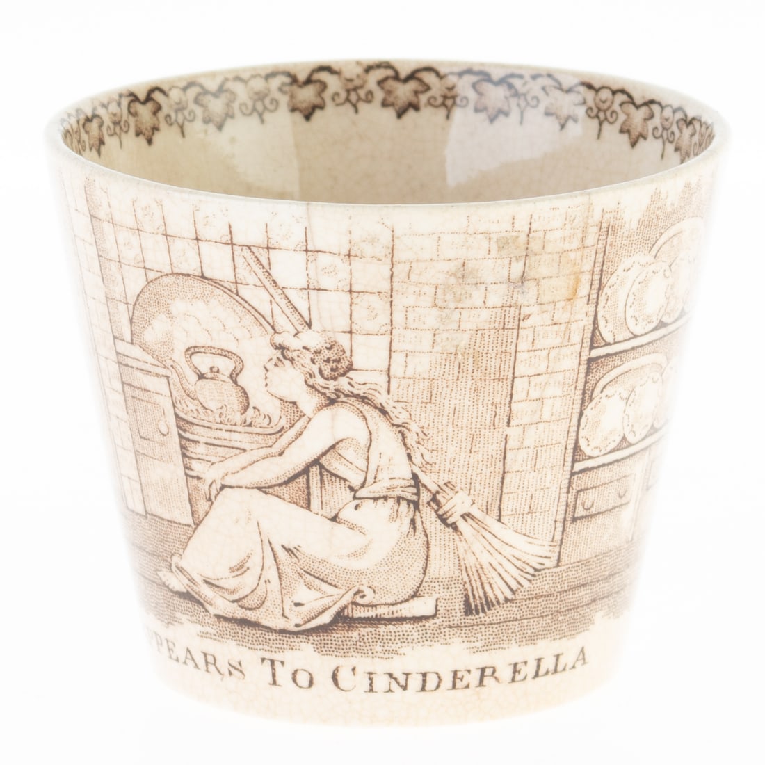 ANTIQUE TRANSFERWARE CINDERELLA PORCELAIN TEACUP: From a collection of Wedgwood and other selected ceramic/porcelain objects. Kindly examine all photographs provided in this listing or ask for a condition report. All items offered are in generally go