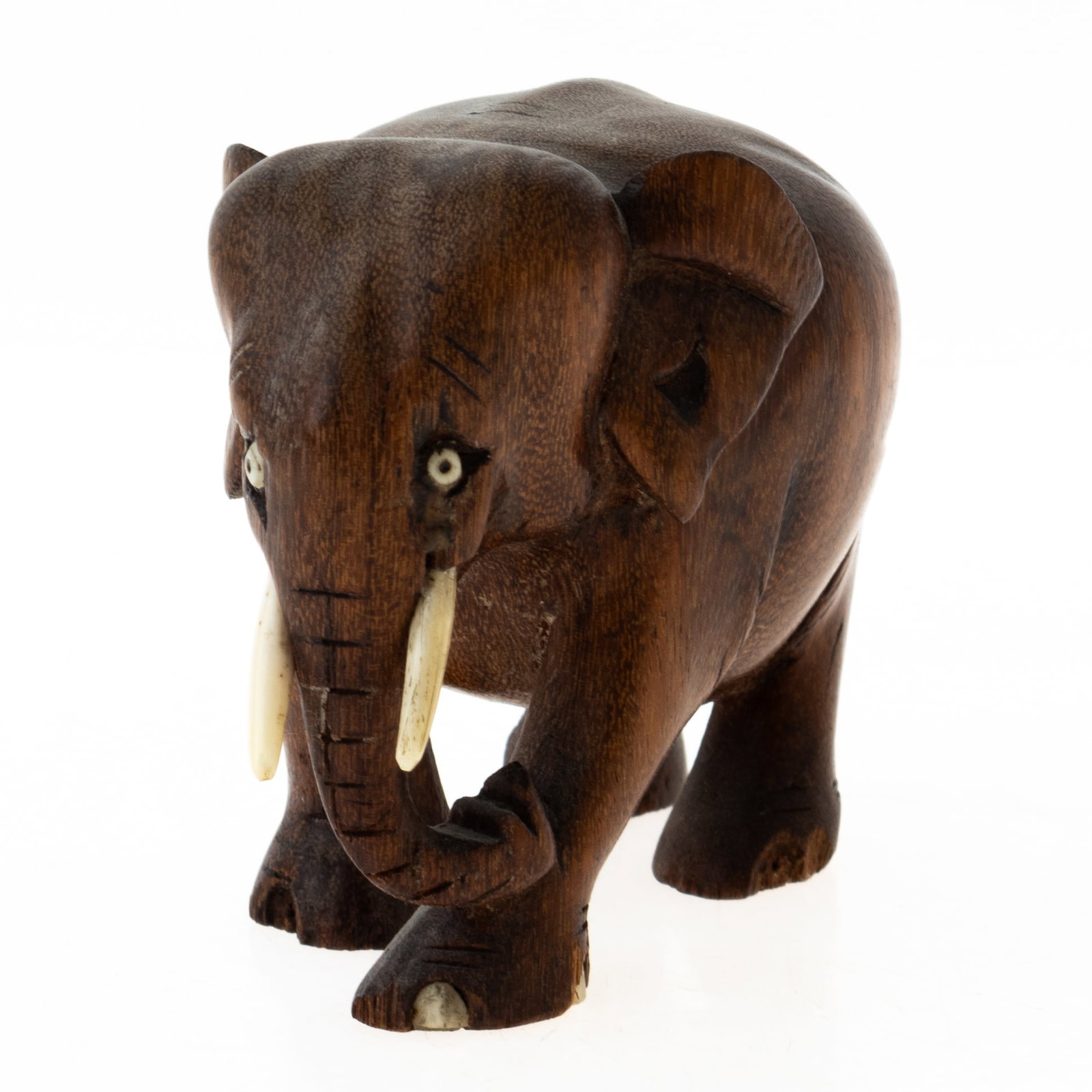 AFRICAN CARVED WOOD ELEPHANT SCULPTURE WITH TUSKS: From a collection of Wedgwood and other selected ceramic/porcelain objects. Kindly examine all photographs provided in this listing or ask for a condition report. All items offered are in generally go