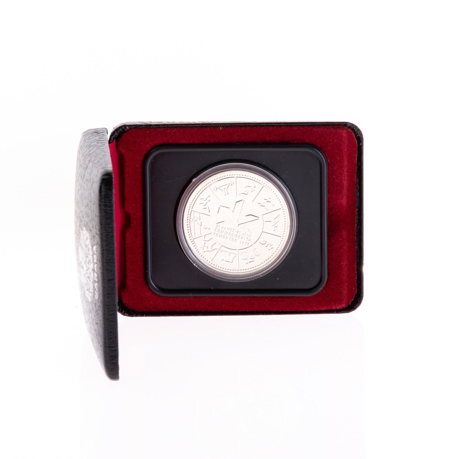 XI OLYMPICS GAMES SILVER COIN: 8.5x6.5x2.5CM.From a collection of Wedgwood and other selected ceramic/porcelain objects. Kindly examine all photographs provided in this listing or ask for a condition report. All items offered are i