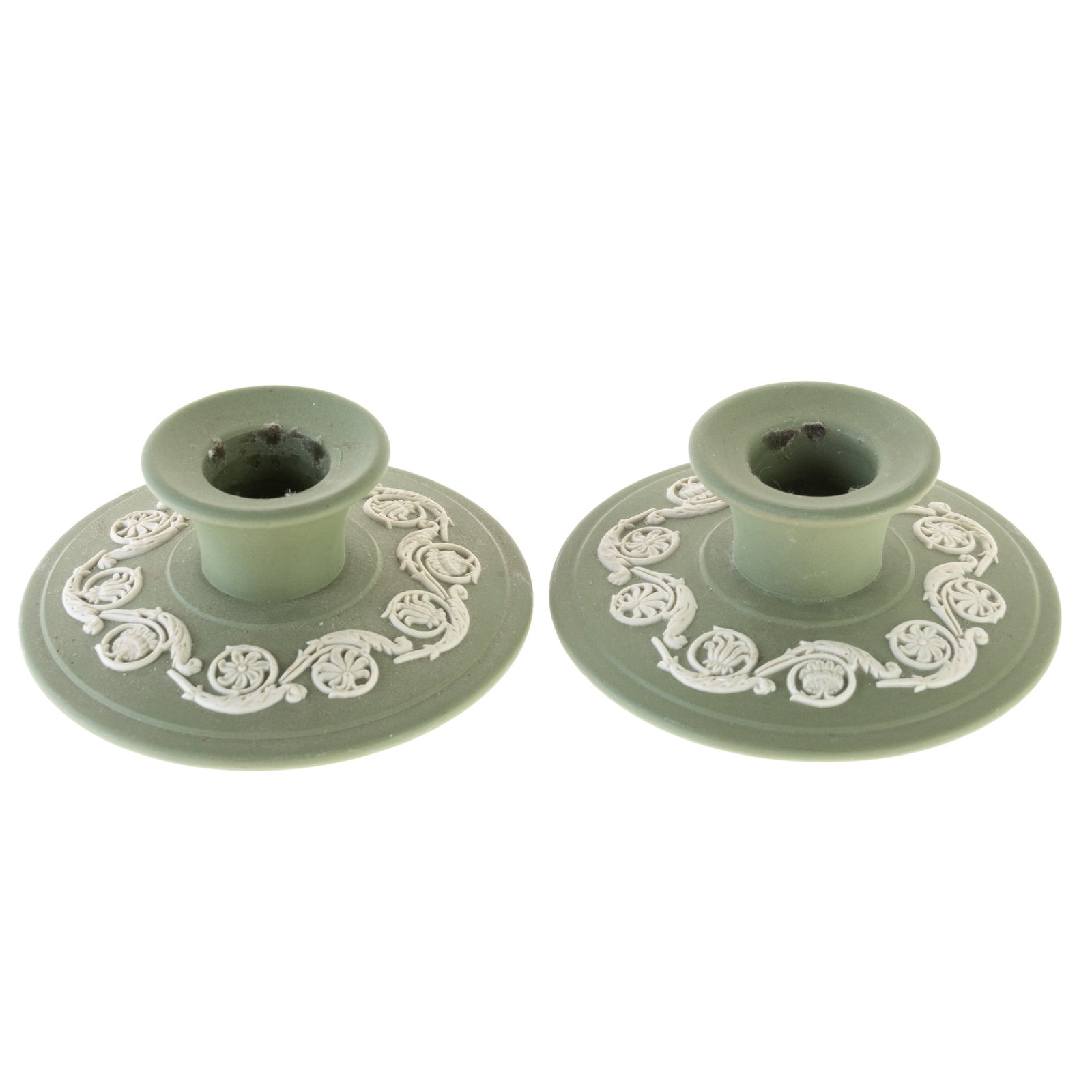 WEDGWOOD GREEN JASPER PORCELAIN CAMEO CANDLE HOLDERS: (DIA) 10CM. From a collection of Wedgwood and other selected ceramic/porcelain objects. Kindly examine all photographs provided in this listing or ask for a condition report. All items offered are in 