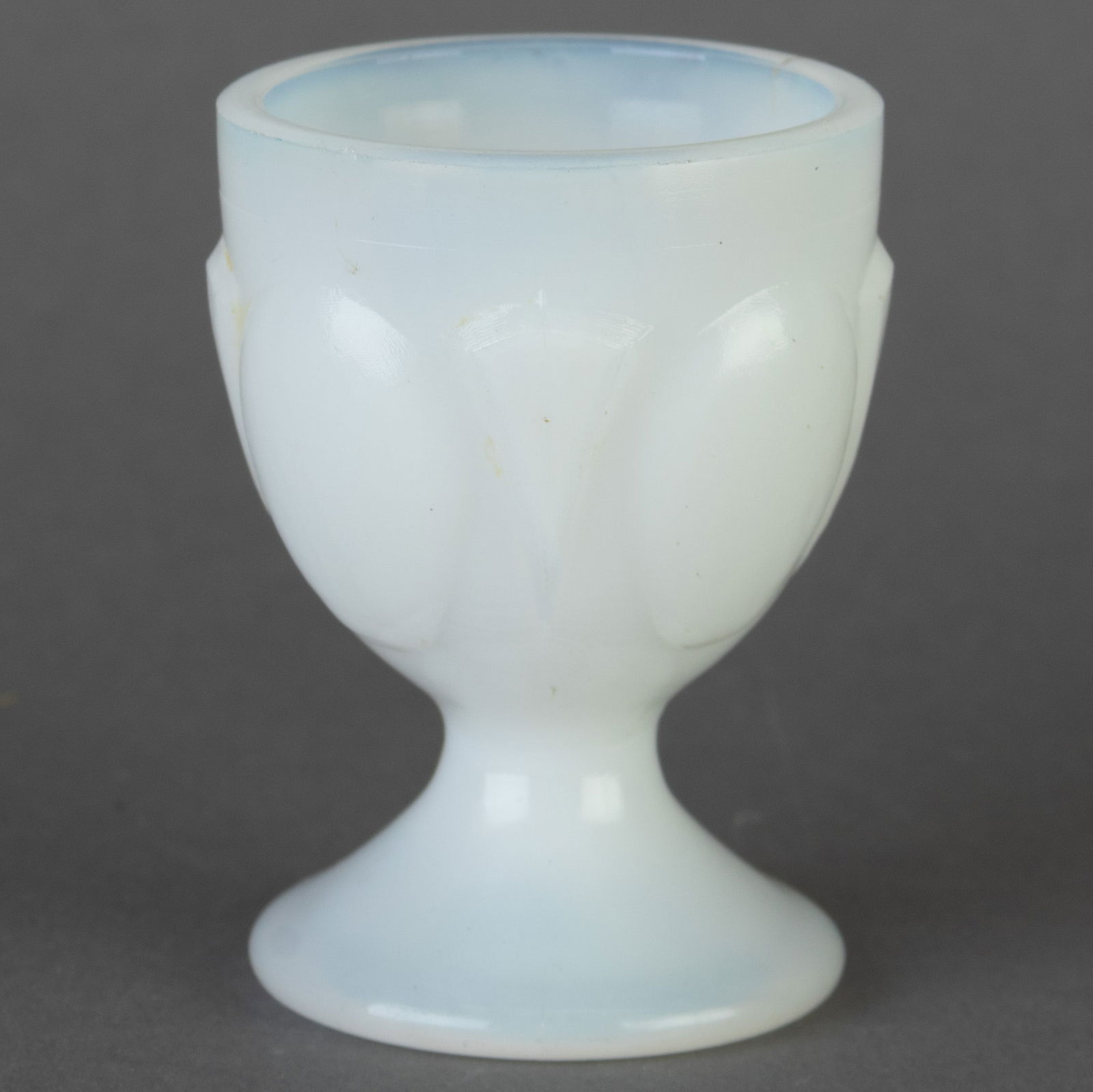 ANTIQUE OPALESCENT MOULDED MILK GLASS EGG CUP HOLDER: From a collection of Wedgwood and other selected ceramic/porcelain objects. Kindly examine all photographs provided in this listing or ask for a condition report. All items offered are in generally go