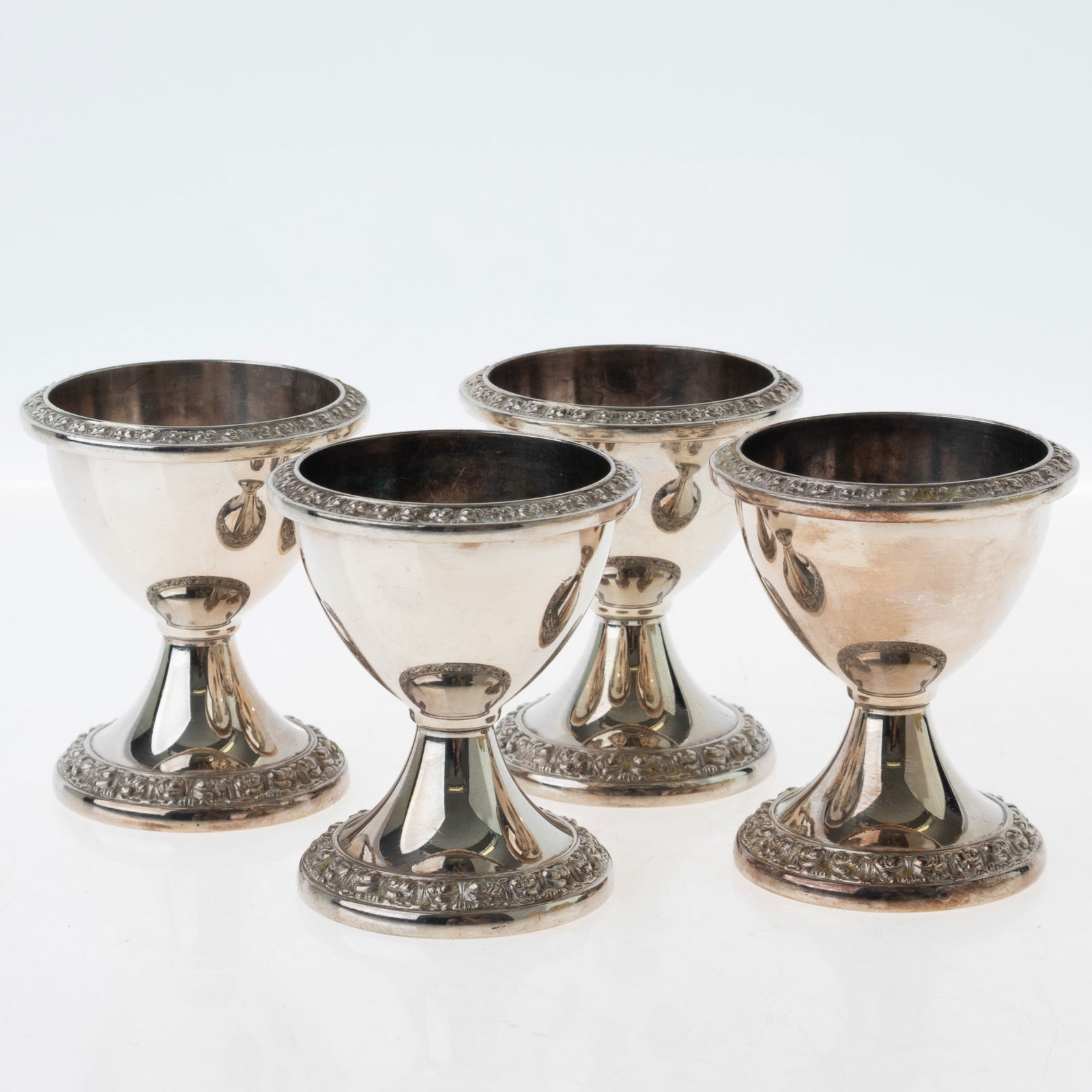 ANTIQUE SET OF 4X SILVER PLATED EGG HOLDER CUPS: From a collection of Wedgwood and other selected ceramic/porcelain objects. Kindly examine all photographs provided in this listing or ask for a condition report. All items offered are in generally go