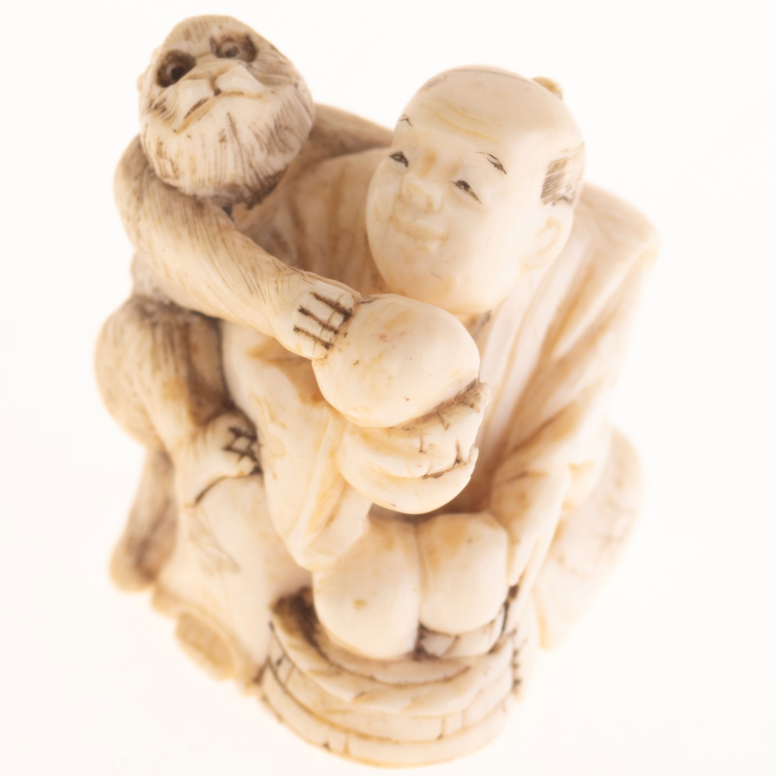 ANTIQUE SIGNED JAPANESE NETSUKE OF A MAN WITH MONKEY (1 of 3)