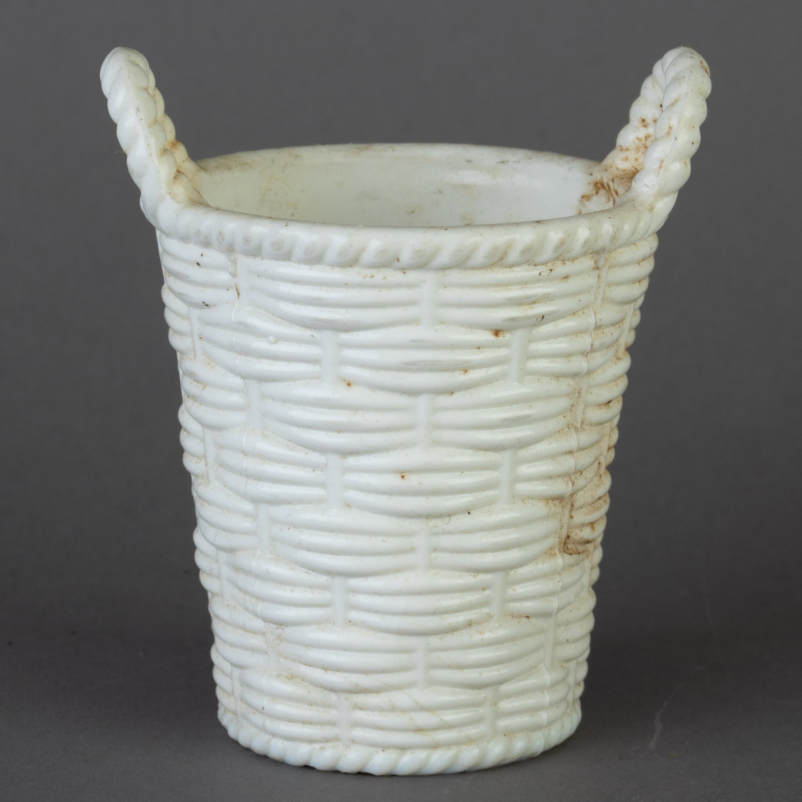 SOWERBY VICTORIAN PRESSED MILK GLASS WEAVE BASKET: From a collection of Wedgwood and other selected ceramic/porcelain objects. Kindly examine all photographs provided in this listing or ask for a condition report. All items offered are in generally go
