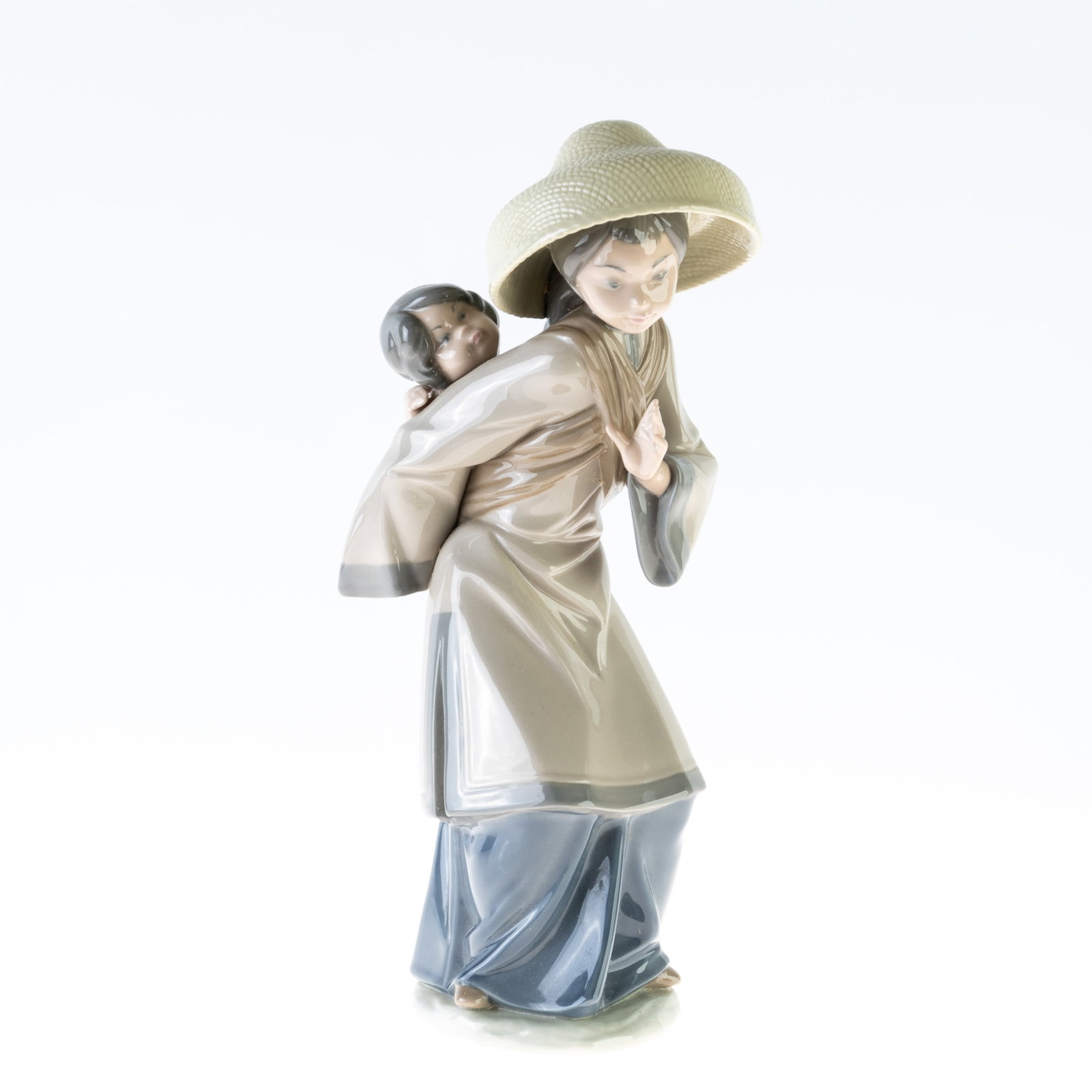 LLADRO PORCELAIN FIGURE: (HEIGHT) 28CM.From a collection of Wedgwood and other selected ceramic/porcelain objects. Kindly examine all photographs provided in this listing or ask for a condition report. All items offered are i