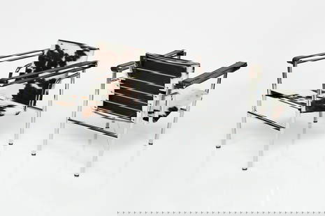 Le Corbusier, 'Basculant' Armchairs (2): Chrome plated steel, spotted leather hide