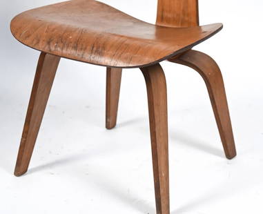 Early Eames DCW Bentwood Chair: Marked DCW underneath. Dimensions: H 29" x W 20" x D 20" x SH 18.5". Condition: Wear to rubber bumpers, soiling on plywood finish, and some veneer cracks consistent with age and use.