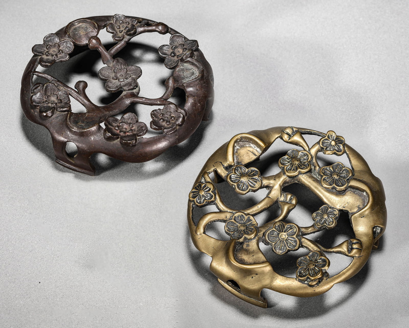 A pair of Chinese copper plum blossom bases. (1 of 14)