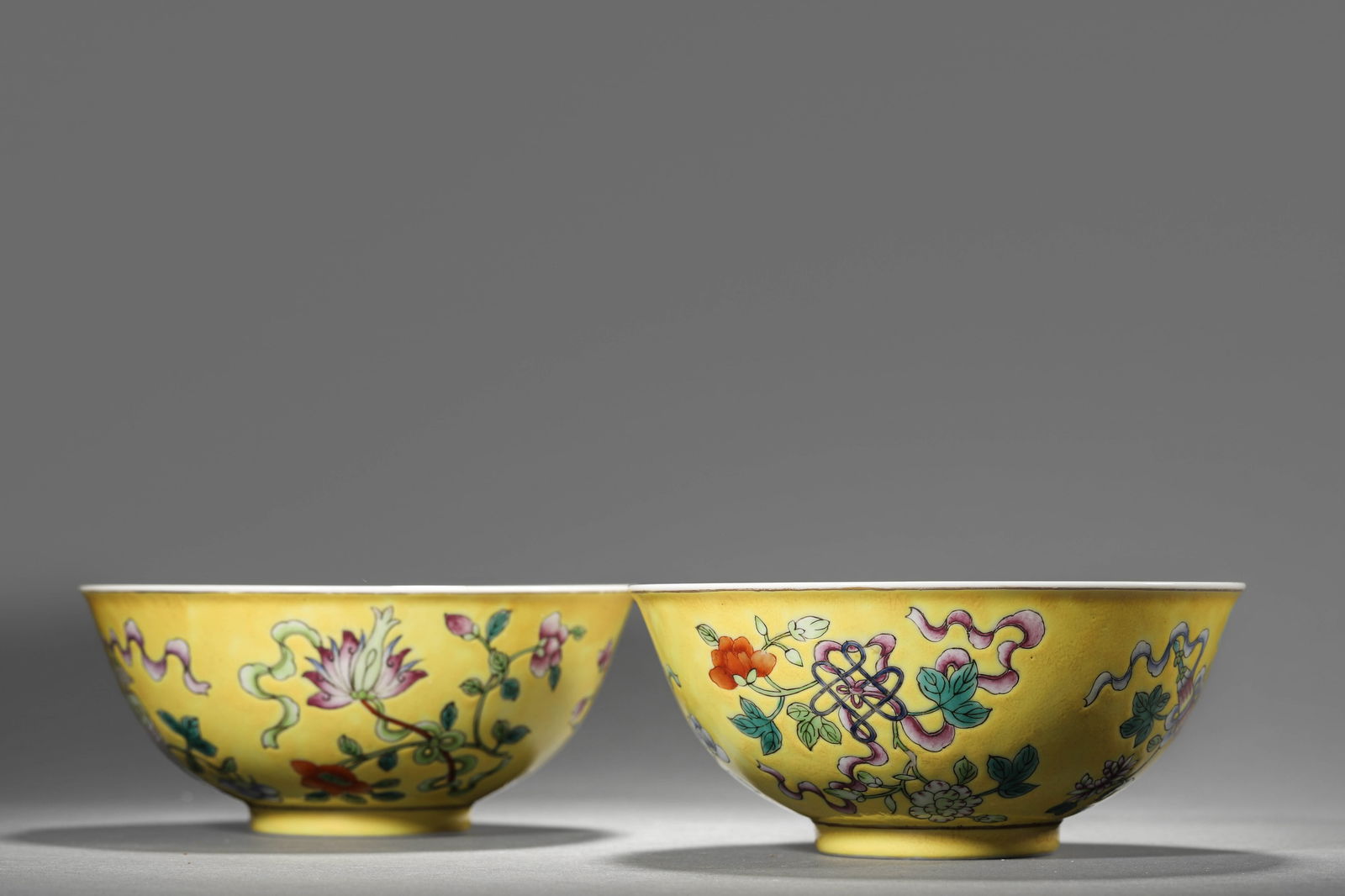 A pair of Chinese yellow ground famille rose bowls with Eight Treasures, Qing Dynasty, Tongzhi (1 of 10)