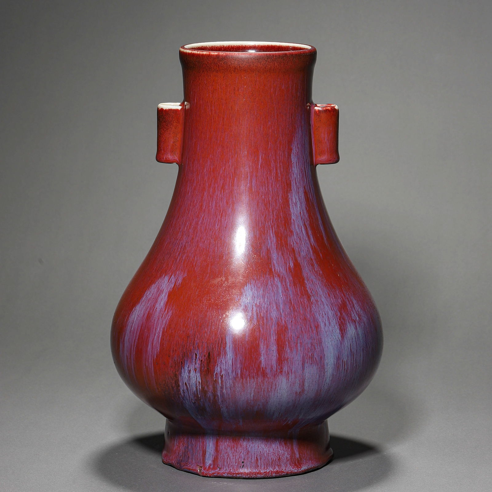 A CHINESE KILN-TRANSFORMED GLAZED VASE WITH TWIN HANDLES, MARKED "YONGZHENG NIAN ZHI," POSSIBLY QING (1 of 3)