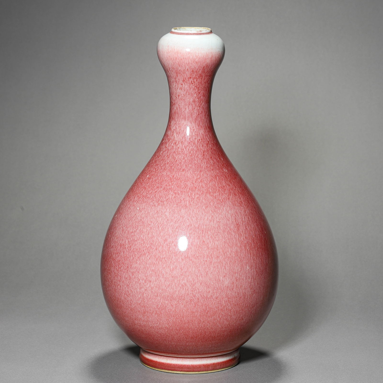 A CHINESE RED-GLAZED GARLIC-HEAD VASE, MARKED "DA QING KANGXI NIAN ZHI," POSSIBLY 17TH CENTURY (1 of 3)