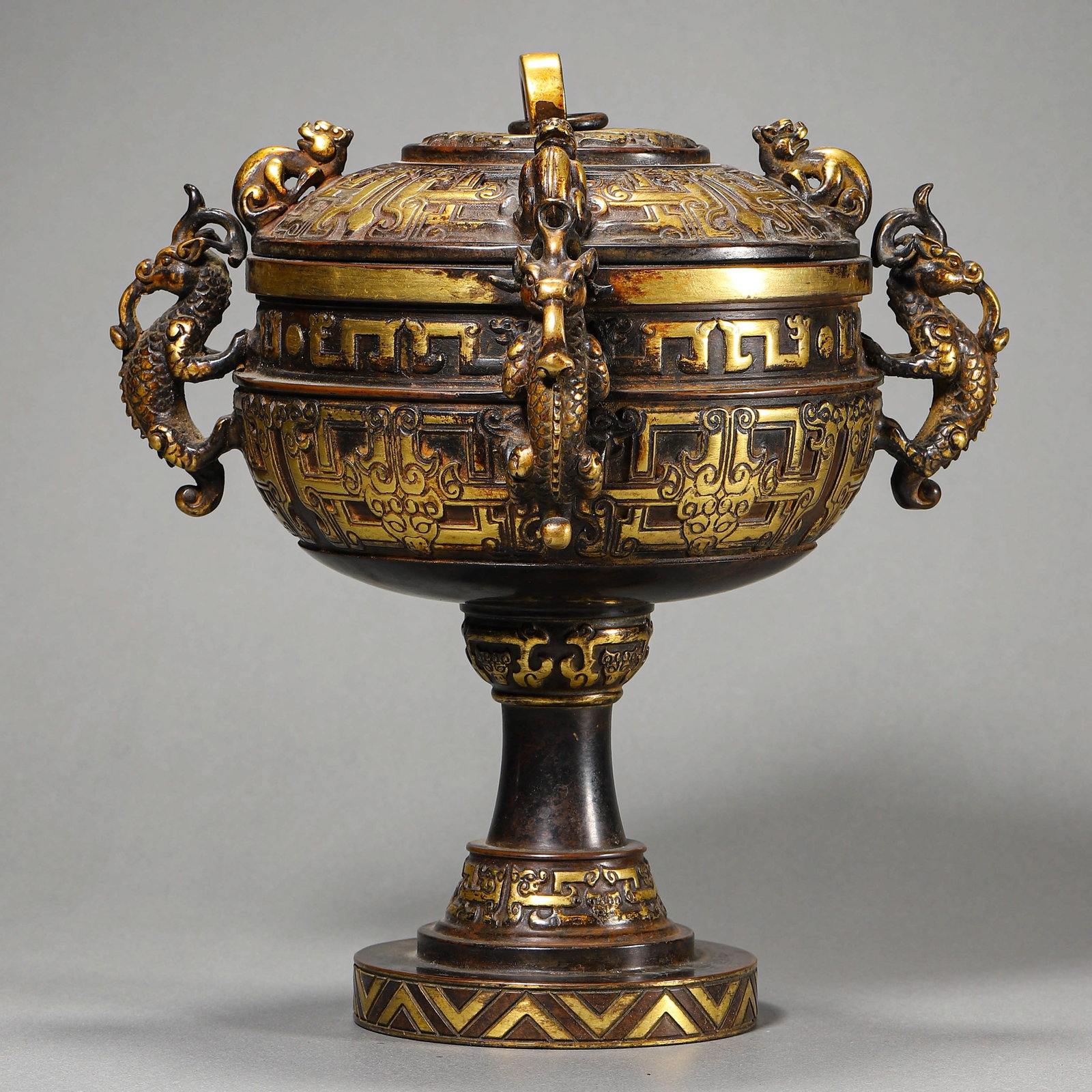 A CHINESE GILT BRONZE BEAN-SHAPED CUP, MARKED "DA MING YONGLE NIAN ZHI," POSSIBLY 15TH CENTURY (1 of 3)
