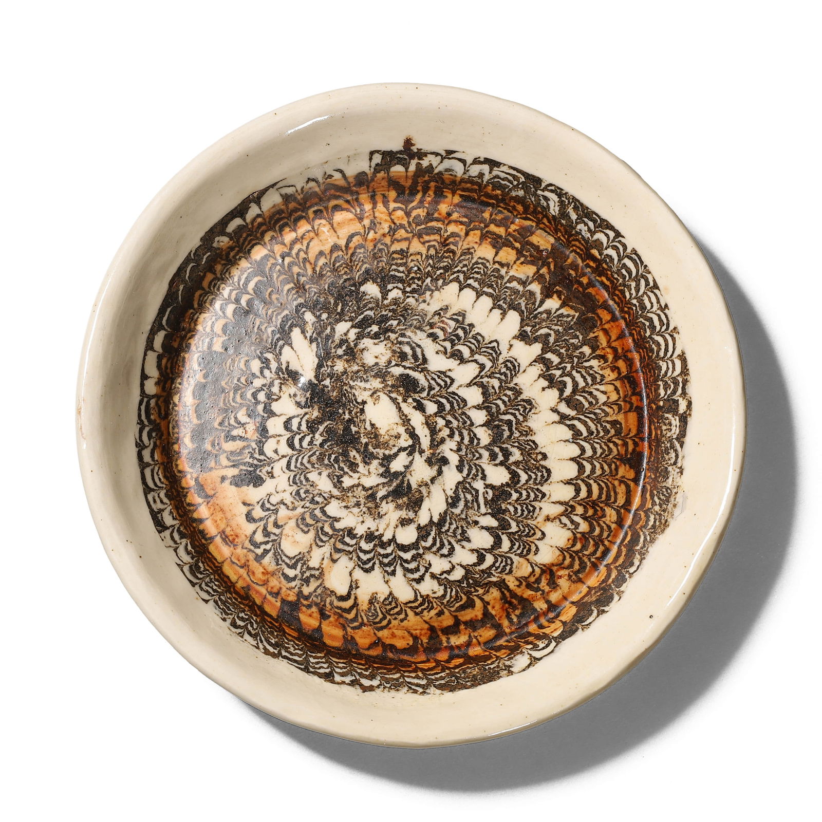 A CHINESE MIXED CLAY GLAZED DISH.: A CHINESE MIXED CLAY GLAZED DISH. Diameter: 4 1/2 in. (11.3 cm), Height: 3/4 in. (1.8 cm)Condition: Any statement made in any catalogue or otherwise regarding the origin, date, age, attribution, authe