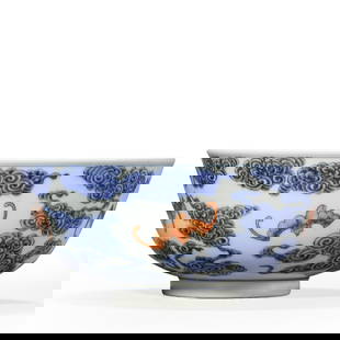 A CHINESE BLUE AND WHITE BOWL WITH IRON-RED CLOUD AND BAT DESIGN, MARKED "DA QING GUANG XU NIAN: A CHINESE BLUE AND WHITE BOWL WITH IRON-RED CLOUD AND BAT DESIGN, MARKED "DA QING GUANG XU NIAN ZHI," POSSIBLY QING DYNASTY, LATE 19TH CENTURY. Rim Diameter: 7 7/16 in. (18.8 cm); Height: 3 3/8 in. (8