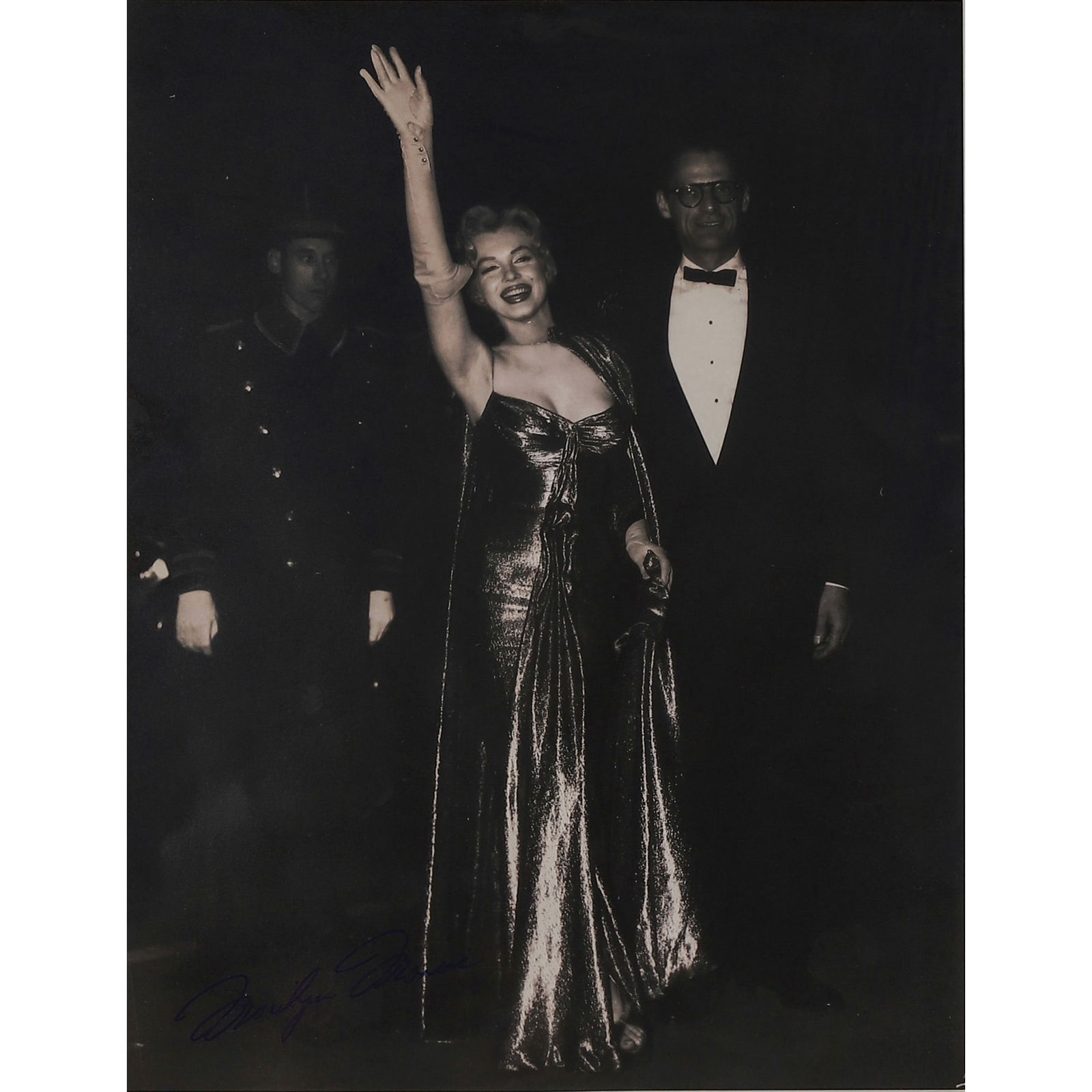 MARILYN MONROE PORTRAIT PHOTOGRAPH: TITLE Marilyn Monroe Portrait Photograph Medium: Gelatin silver print, mounted on cardboard Signature: Signed in blue ink “Marilyn Monroe” at lower left on the photograph Dimensions Photograph