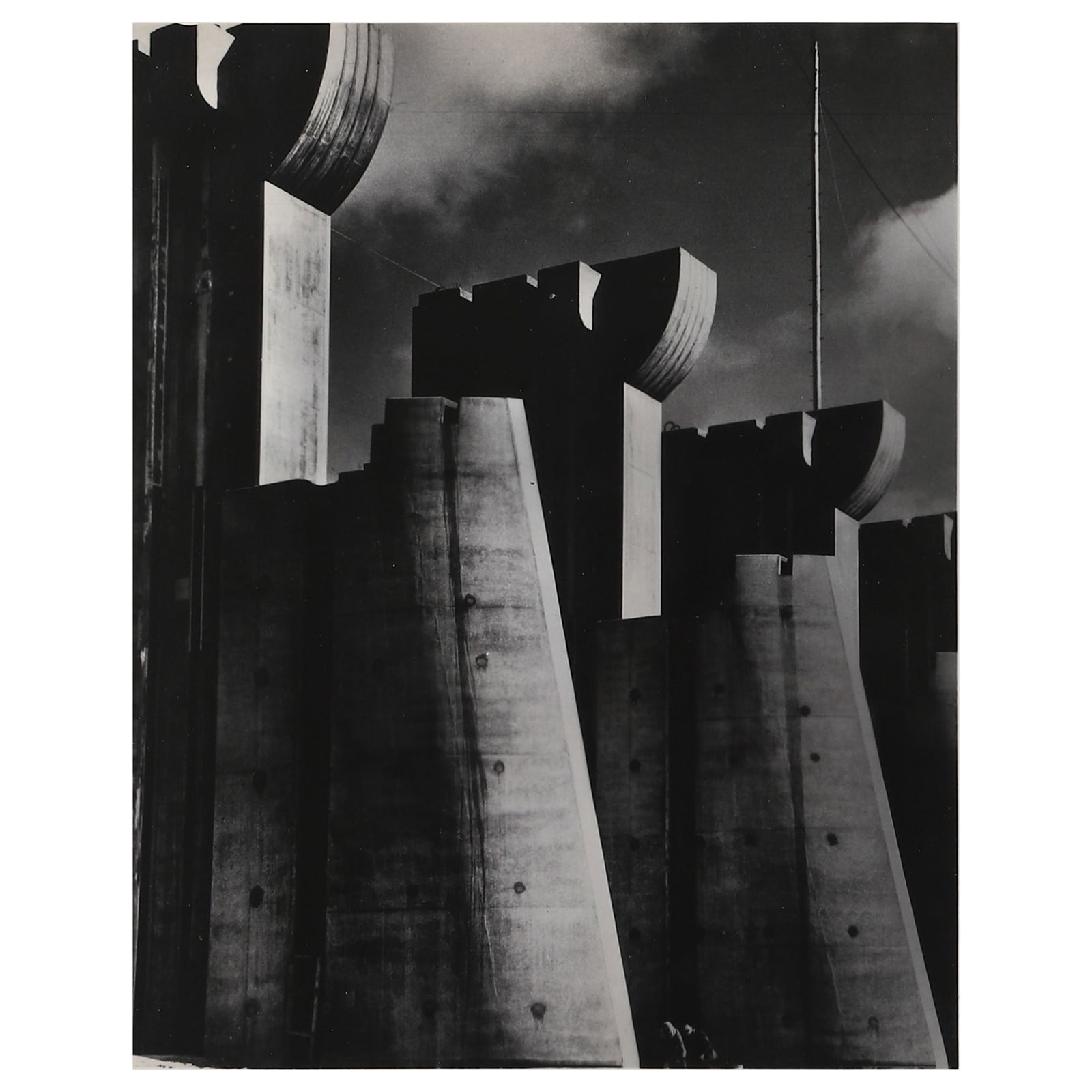 MARGARET BOURKE-WHITE (1904–1971) FORT PECK DAM, MONTANA: Artist: Margaret Bourke-White Title: FORT PECK DAM, MONTANA Medium: Gelatin silver print, mounted on cardboard Signature: Stamp on verso, signed in pencil lower right Dimensions: Photograph 9 3/4 × 1