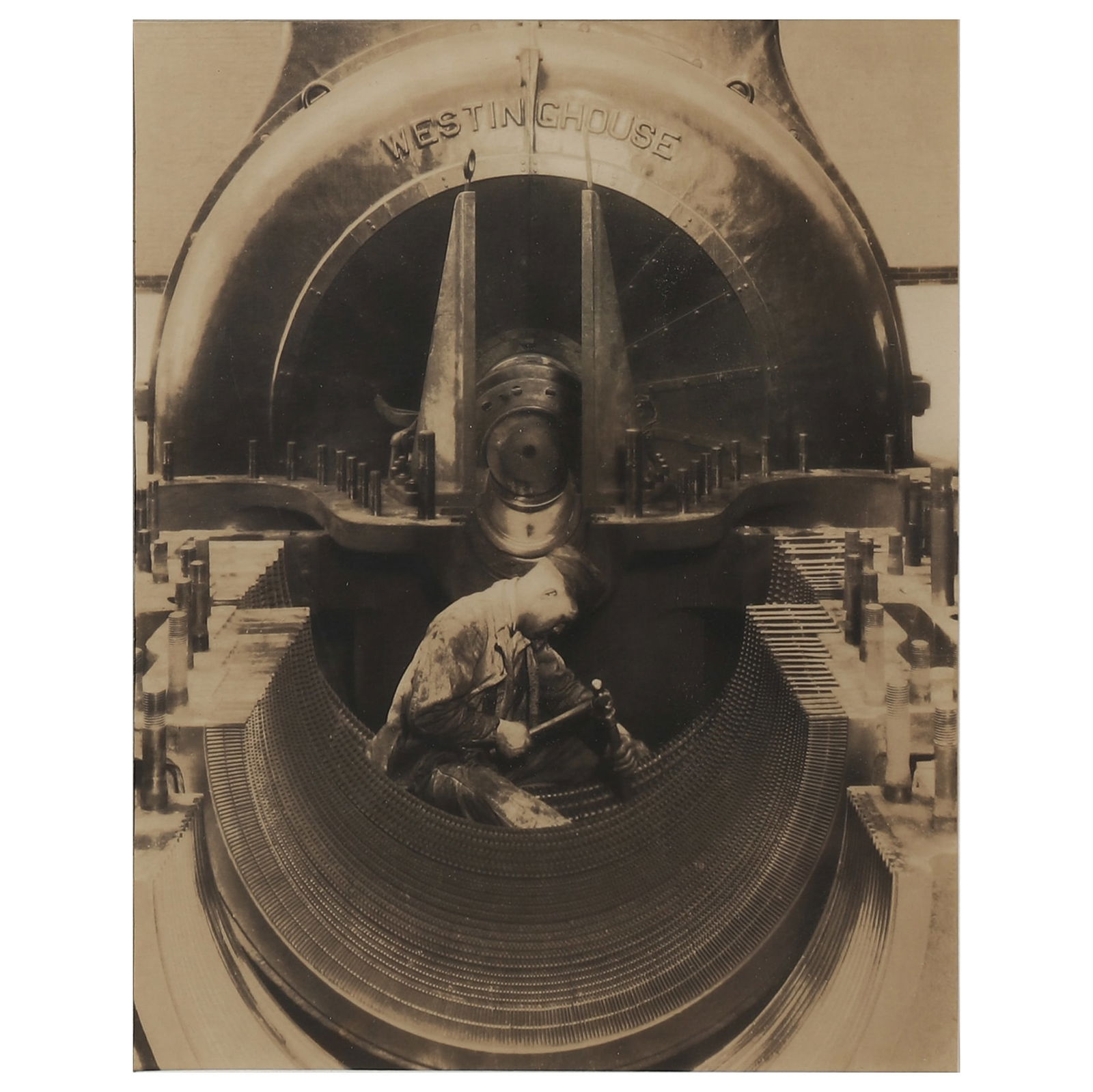 LEWIS WICKES HINE (1874–1940) MECHANIC AND STEAM PUMP: Artist Lewis Wickes Hine Title MECHANIC AND STEAM PUMP (PHOTOGRAPHED BY LEWIS WICKES HINE) Medium Gelatin silver print, mounted on board Signature Artist’s stamp on the reverse of the photograph Dim