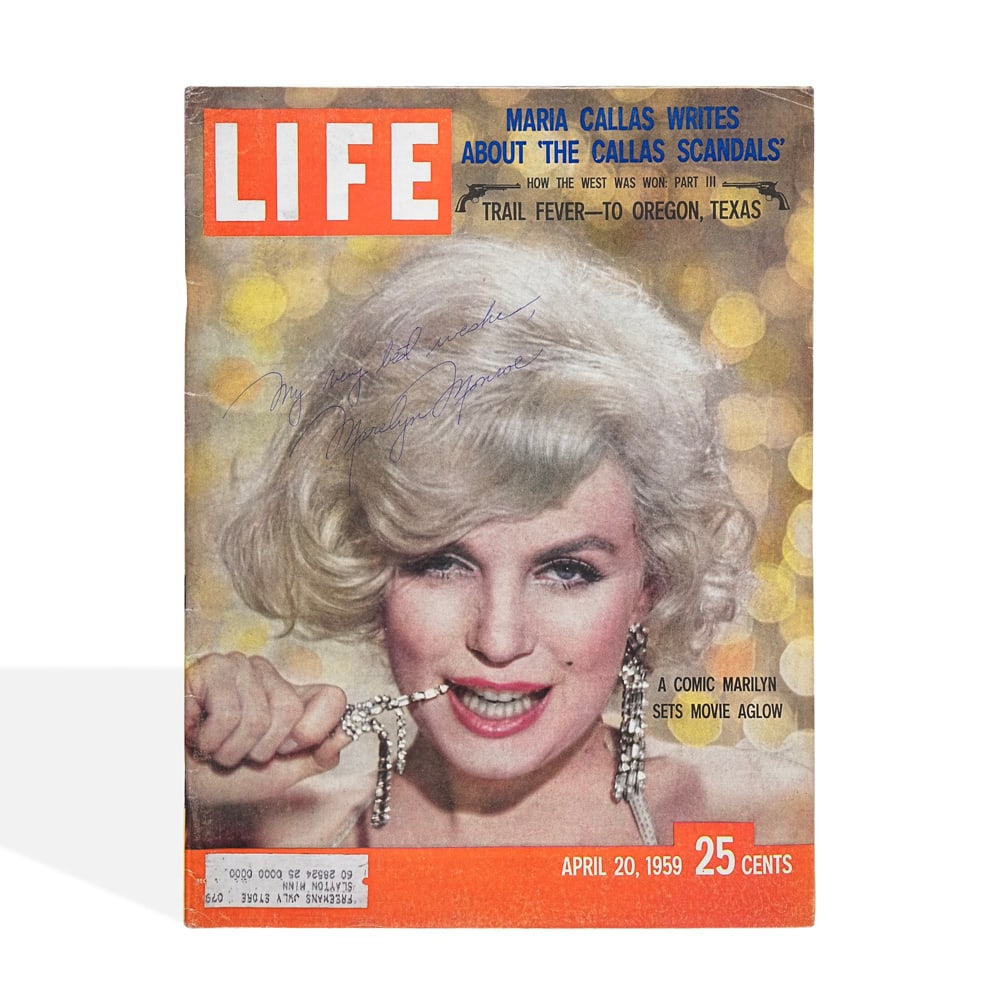 MARILYN MONROE SIGNED LIFE MAGAZINE (1959): 13 7/8 x 10 1/2 in (35.3 x 26.8 cm) This signed 1959 issue of LIFE magazine represents a striking artifact from the height of Marilyn Monroe's global fame. As one of the most recognizable figures of t