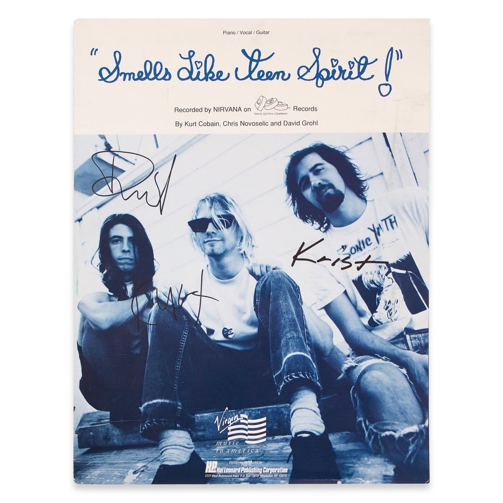 NIRVANA SIGNED "SMELLS LIKE TEEN SPIRIT" SHEET MUSIC: 12 x 9 in (30.5 x 23 cm) Provenance and Authentication: This collectible has undergone a rigorous forensic evaluation. The signatures were carefully analyzed across multiple criteria, including ink