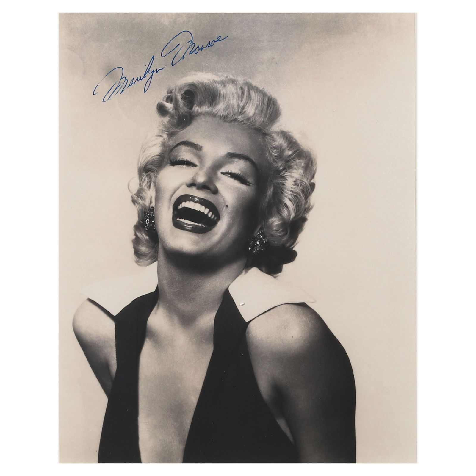 MARILYN MONROE SIGNED PHOTOGRAPH: Title MARILYN MONROE SIGNED PHOTOGRAPH Medium gelatin silver photograph, mounted on board Signature signed in blue ink on the upper left of the photograph Dimensions Photograph: 7 7/8 × 9 15/16 in. (