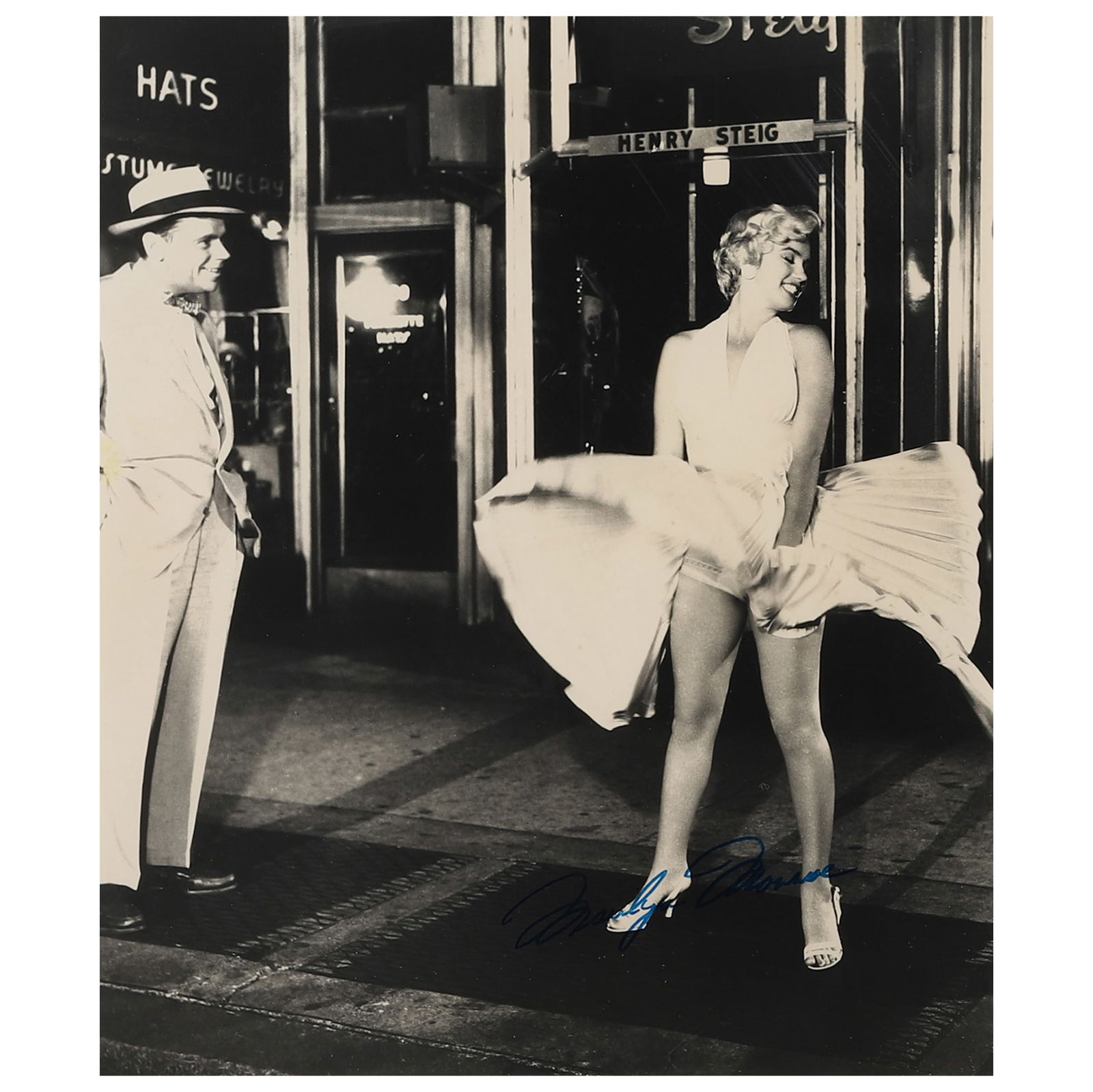 MARILYN MONROE, FILM STILL FROM THE SEVEN YEAR ITCH: Title Marilyn Monroe, Film Still from The Seven Year Itch Medium Gelatin silver photograph, mounted on board Signature Signed in blue ink on the lower right of the photograph Dimensions Photograph: 11