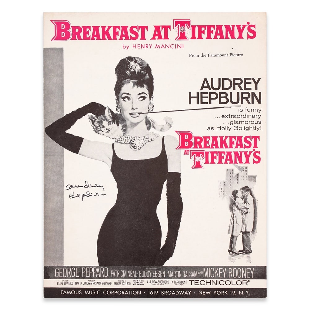 AUDREY HEPBURN SIGNED "BREAKFAST AT TIFFANY'S" SHEET MUSIC: 12 x 9 in (30.5 x 23 cm) Provenance and Authentication: This collectible has undergone a rigorous forensic evaluation. The signatures were carefully analyzed across multiple criteria, including ink