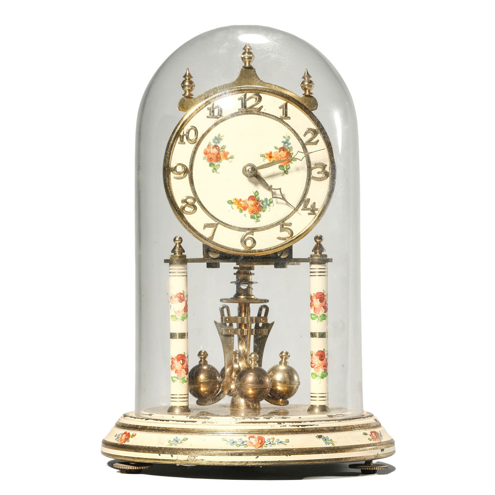 A KUNDO 400-DAY ANNIVERSARY CLOCK UNDER GLASS DOME.: Height: 8 5/8 in. (22 cm). A vintage Kundo (Kieninger & Obergfell) anniversary clock, made in West Germany, featuring a hand-painted floral dial and decorated columns, with four brass ball pendulums.