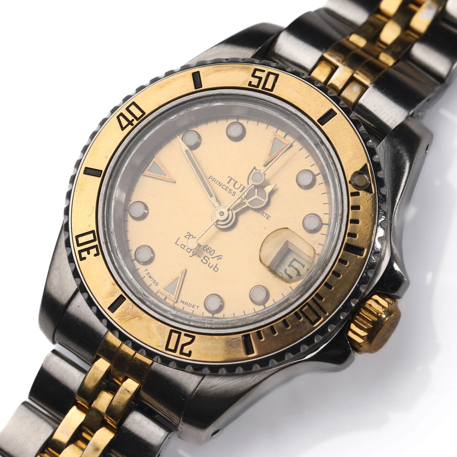 TUDOR PRINCESS DATE “LADY SUB?? TWO-TONE STAINLESS STEEL WRISTWATCH: Dimensions: Dial diameter approximately 1 3/16 in. (29.7 mm). Description A classic Tudor Princess Date “Lady Sub” wristwatch, featuring a stainless steel case with a gold-tone rotating