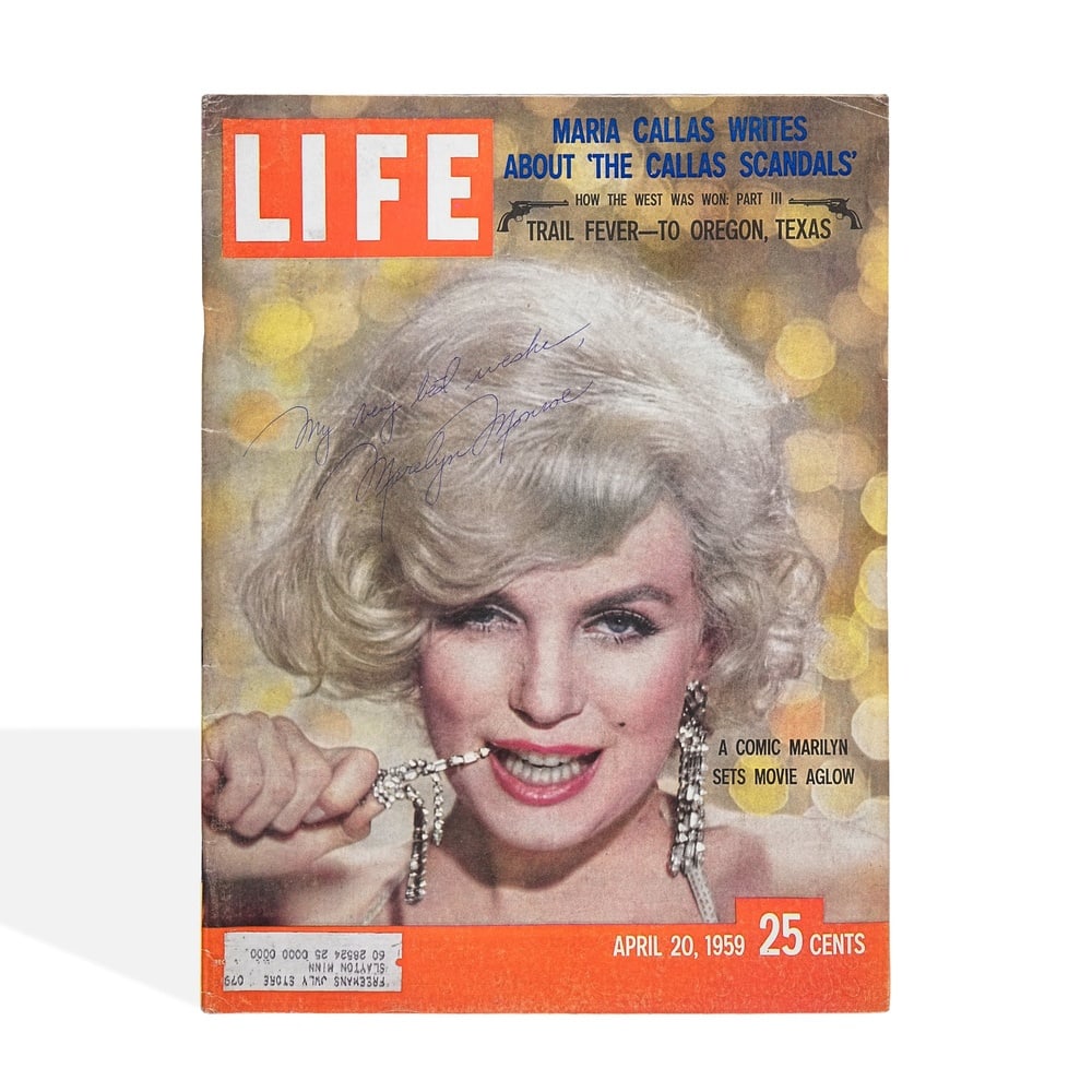 MARILYN MONROE SIGNED LIFE MAGAZINE (1959): 13 7/8 x 10 1/2 in (35.3 x 26.8 cm) This signed 1959 issue of LIFE magazine represents a striking artifact from the height of Marilyn Monroe's global fame. As one of the most recognizable figures of