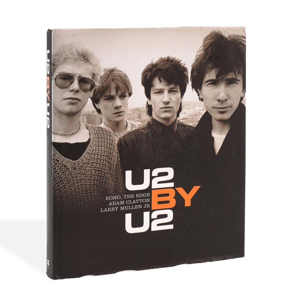 U2 FULLY SIGNED U2 BY U2 BOOK: 12 5/8 x 10 1/2 in (32 x 26.7 cm) Provenance and Authentication: This collectible has undergone a rigorous forensic evaluation. The signatures were carefully analyzed across multiple criteria, includi