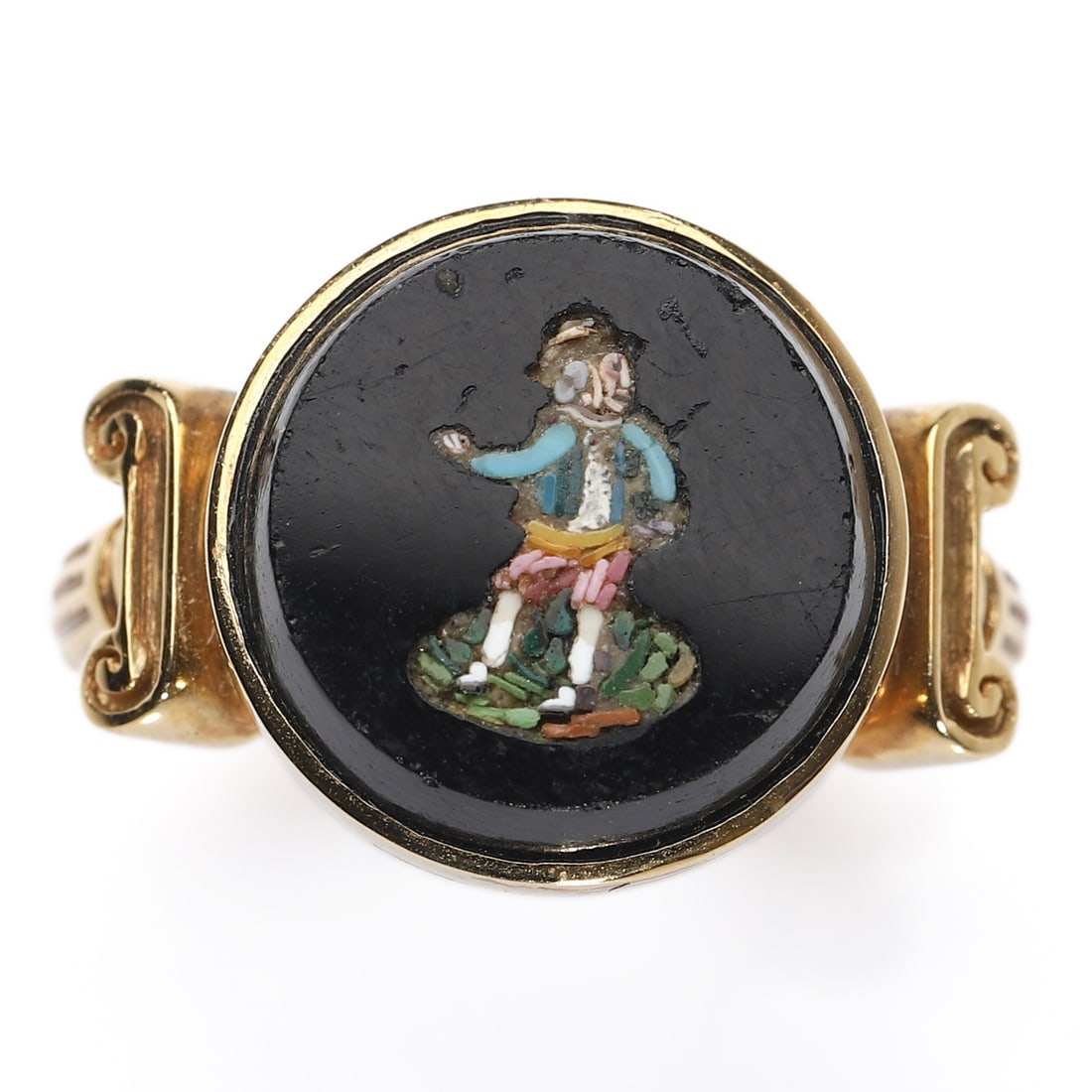 AN ITALIAN MICRO-MOSAIC GOLD RING, 19TH CENTURY: Set with a circular micro-mosaic plaque depicting a standing gentleman in period attire against a black glass ground, mounted in 18K yellow gold with volute shoulders. Dimensions: Bezel: 12.2 mm;