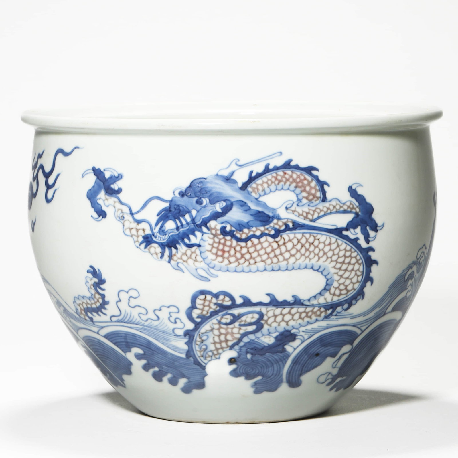 A BLUE AND WHITE AND UNDERGLAZE-RED DRAGON JAR.: Height 6 1/2 in (16.5 cm); Rim Diameter 9 1/16 in (23 cm)