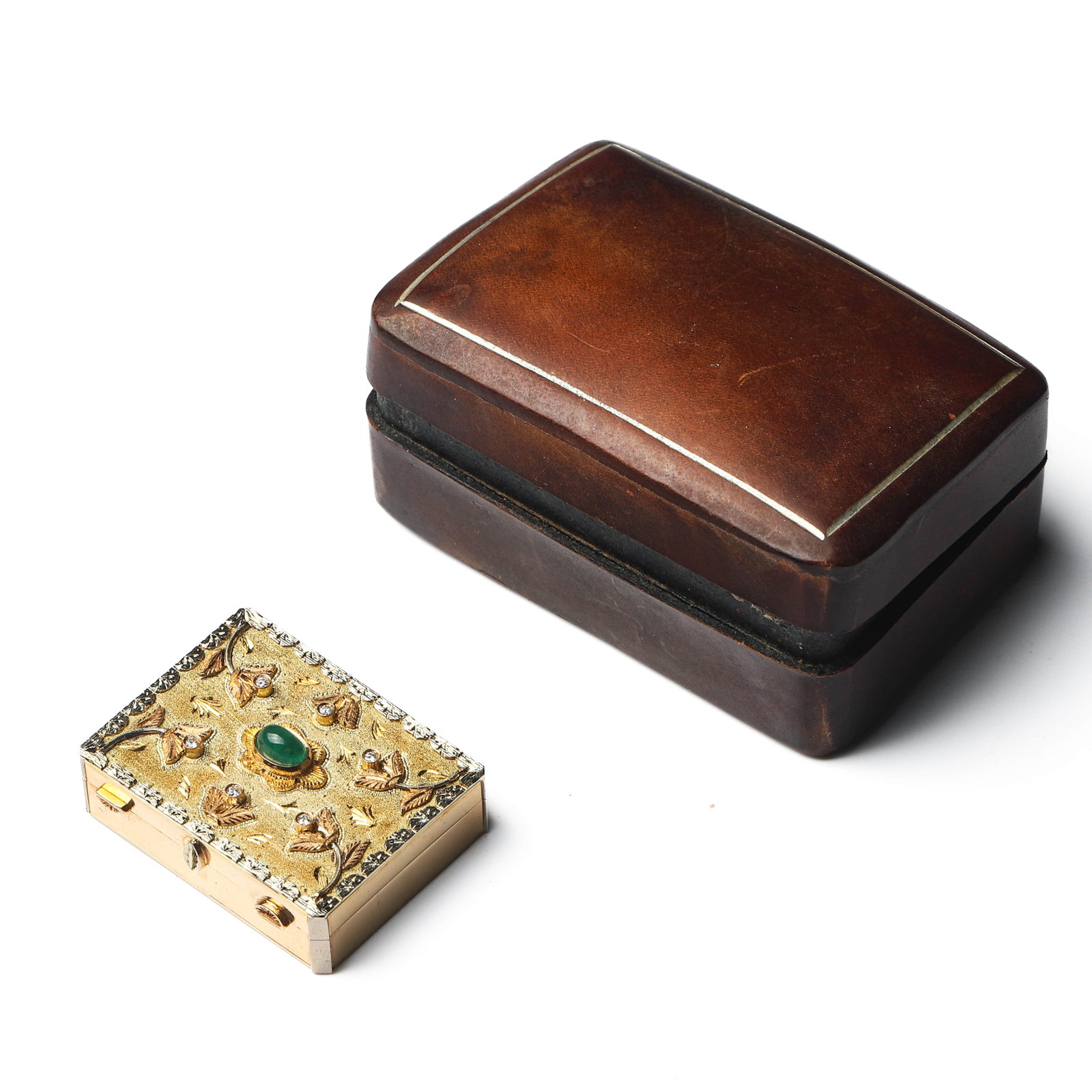 EARLY 20TH CENTURY, AN ITALIAN GOLD, EMERALD AND DIAMOND PILL BOX, SIGNED W. RAFAIOQI, MARKED 750: Dimensions 1 7/16 × 1 3/16 × 9/16 in. (37 × 30 × 14 mm); Weight: 25.2 g Description An exquisite Italian antique gold pill box, handcrafted in 18K gold (marked 750) and signed by the goldsmith W. 