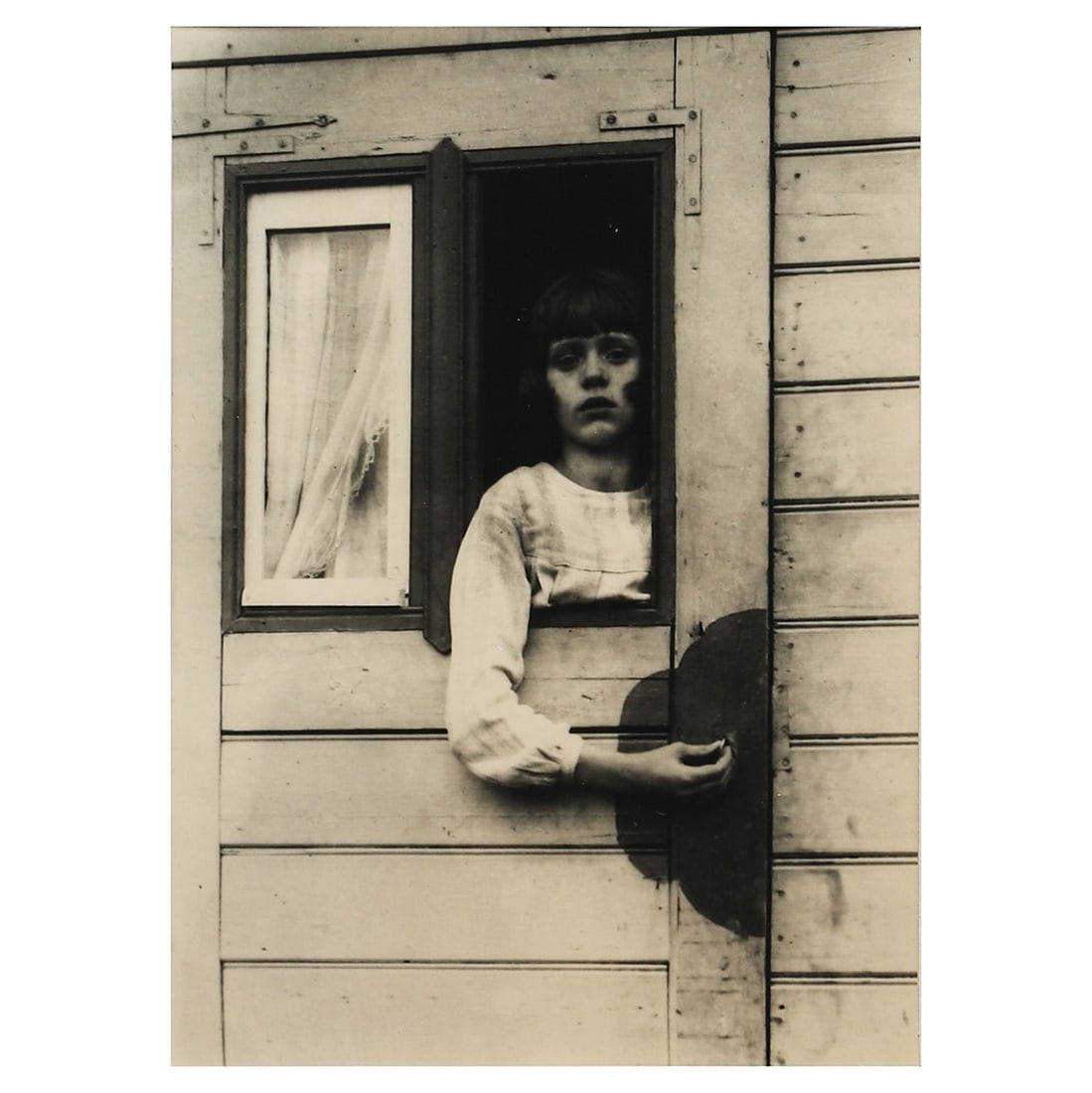 AUGUST SANDER (1876–1964), GIRL IN FAIRGROUND CARAVAN (1 of 4)