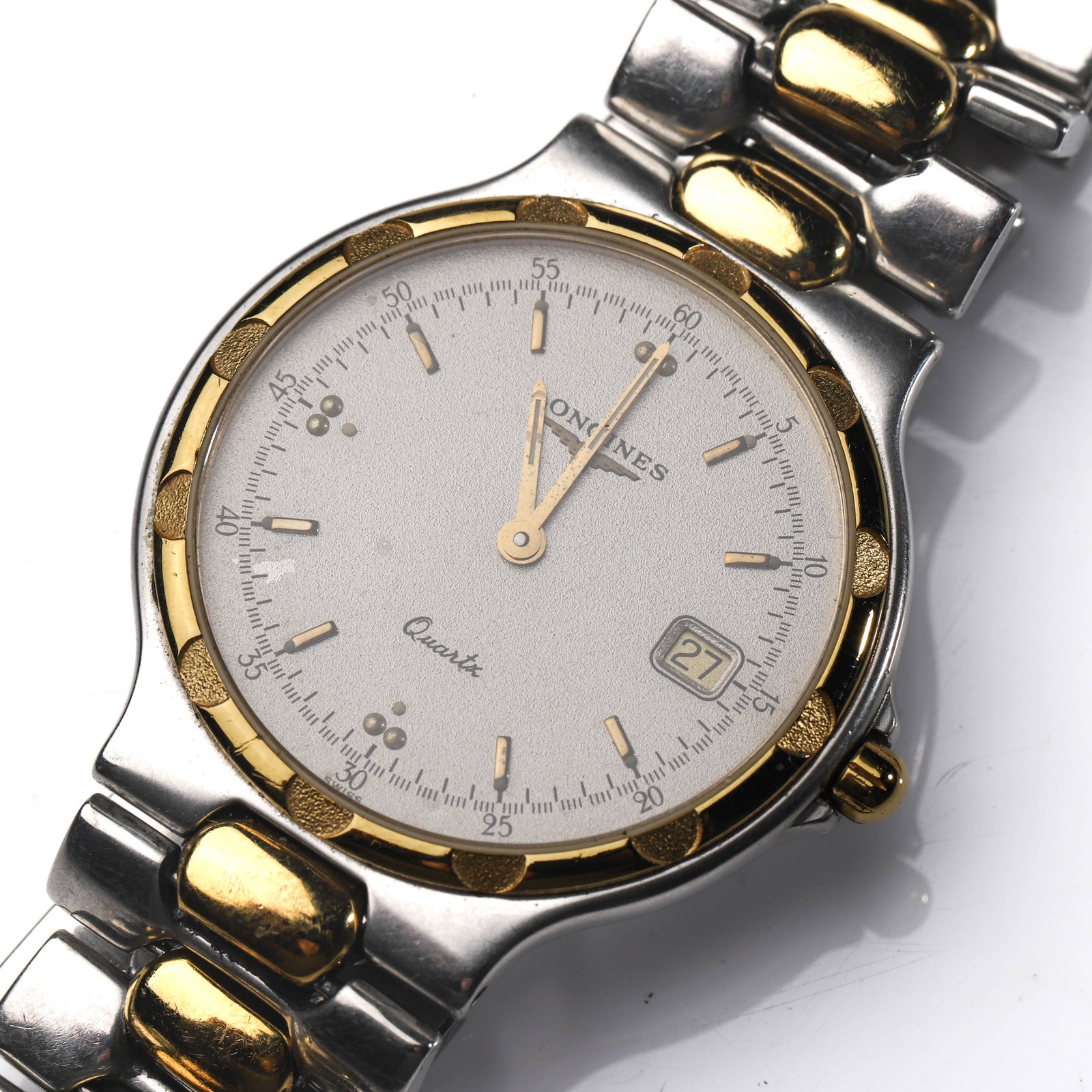LONGINES CONQUEST QUARTZ WRISTWATCH: Dimensions Dial diameter: 1 7/16 in (36.5 mm). Description A Swiss-made Longines Conquest quartz wristwatch, featuring a silver-toned textured dial with applied baton hour markers, luminous accents,