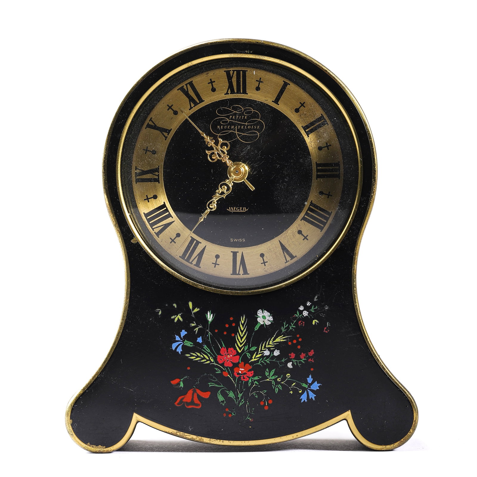 A SWISS BLACK LACQUERED ALARM CLOCK BY JAEGER: Length: 4 1/8 in (10.5 cm); Height: 4 7/8 in (12.3 cm). This charming Swiss-made alarm clock by Jaeger features a black lacquered case with elegant gold trim and a floral motif on the base. The round