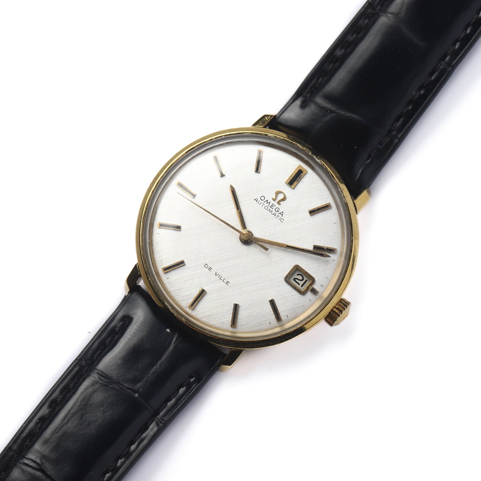 OMEGA DE VILLE AUTOMATIC DATE WRISTWATCH: Dimensions Dial diameter: 1 7/16 in (36.7 mm); Overall length: 9 1/4 in (23.5 cm) Description A classic Omega De Ville automatic wristwatch featuring a refined gold-tone round case and a silvered