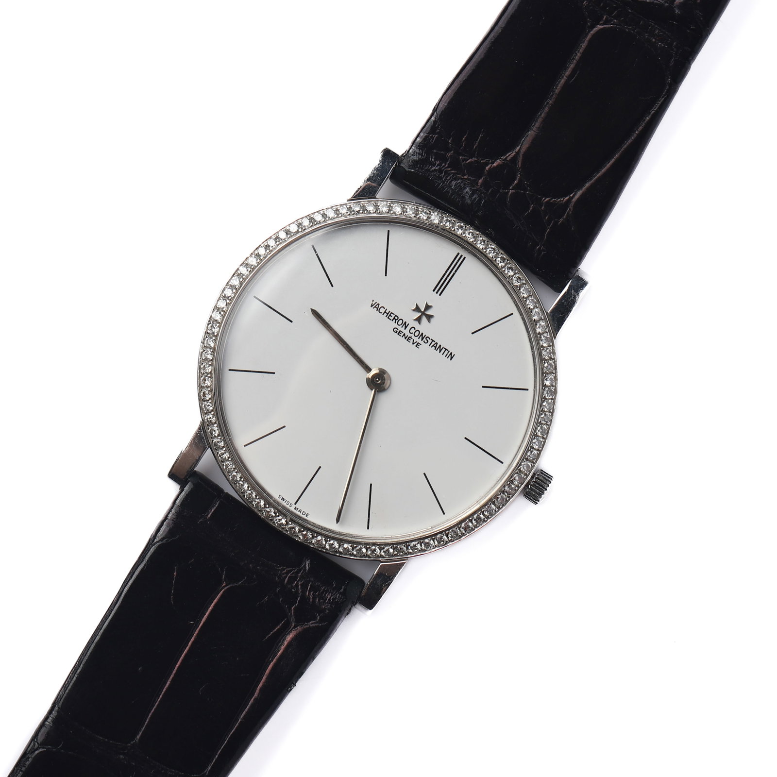 VACHERON CONSTANTIN DIAMOND BEZEL MANUAL WIND WRISTWATCH: Dimensions Dial diameter: 1 5/16in (33.6mm); Overall length: 8 1/4in (21cm) Description A refined Vacheron Constantin manual wind wristwatch featuring a minimalist silvered dial with slender baton
