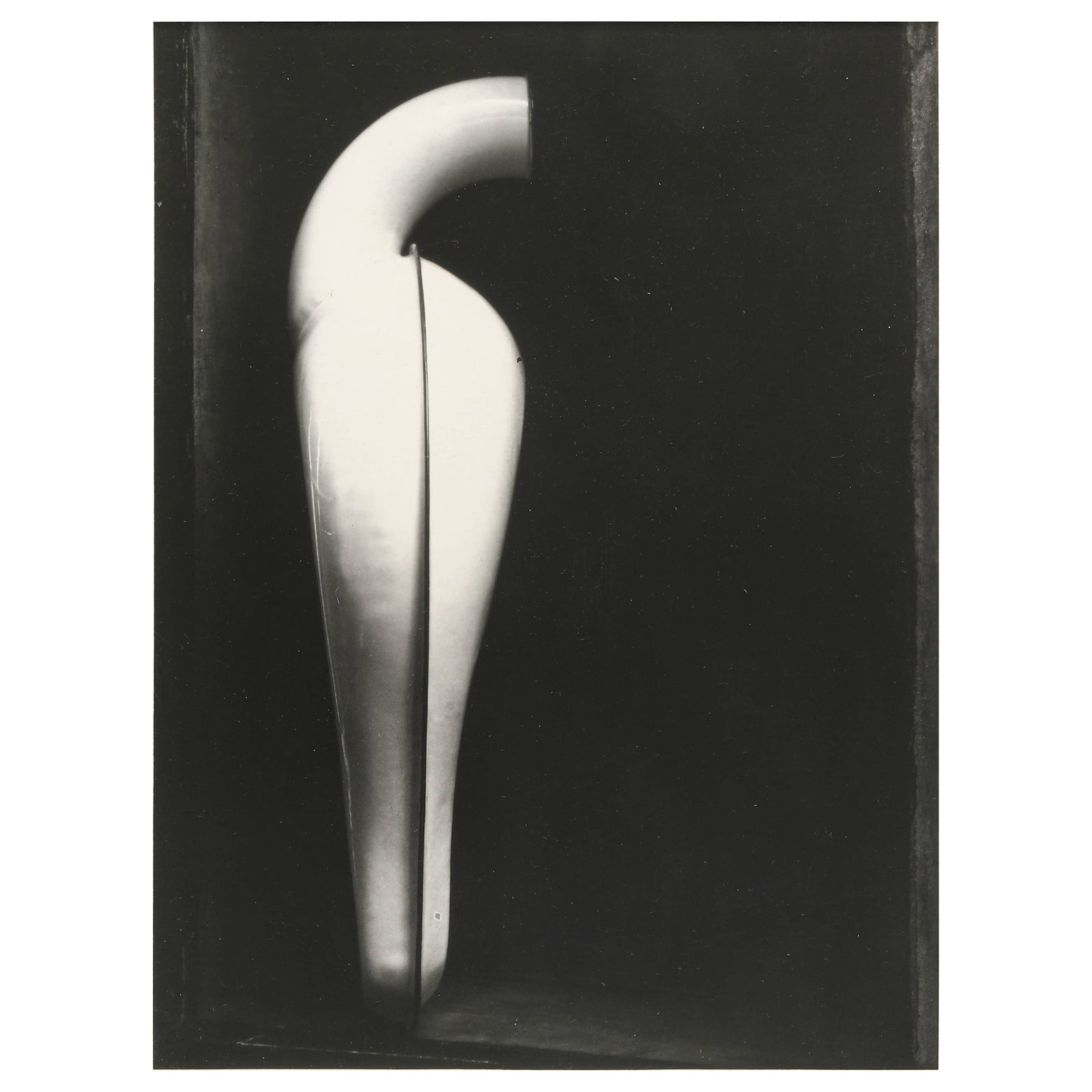 EDWARD WESTON (1886–1958), URINAL: Artist Edward Weston Title URINAL Medium Silver gelatin print, mounted on board Signature Signed in pencil, lower right recto Dimensions Image 7.05 × 9.41 in. (17.9 × 23.9 cm); Frame 15.75 × 15.75 
