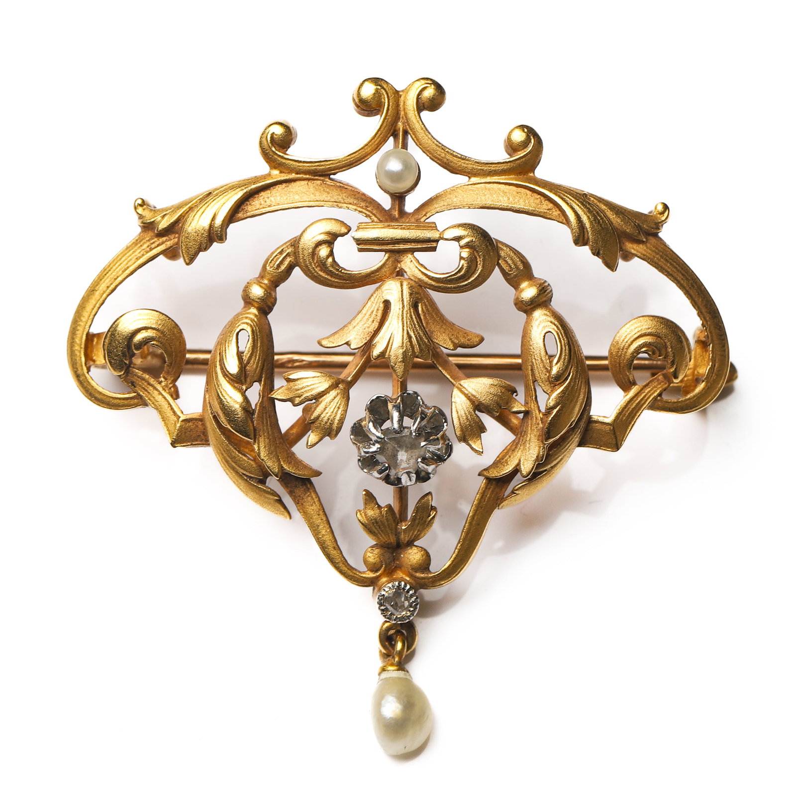 ART NOUVEAU (1880–1920), A FRENCH GOLD BROOCH-PENDANT WITH SCROLLING FLORAL MOTIFS, EAGLE HEAD: Dimensions 1 7/16 × 1 7/16 in. (37 × 36 mm); Weight: 5.55 g Description A finely crafted French brooch-pendant in 21K gold, featuring a high-relief design of scrolling floral motifs. The gracefully