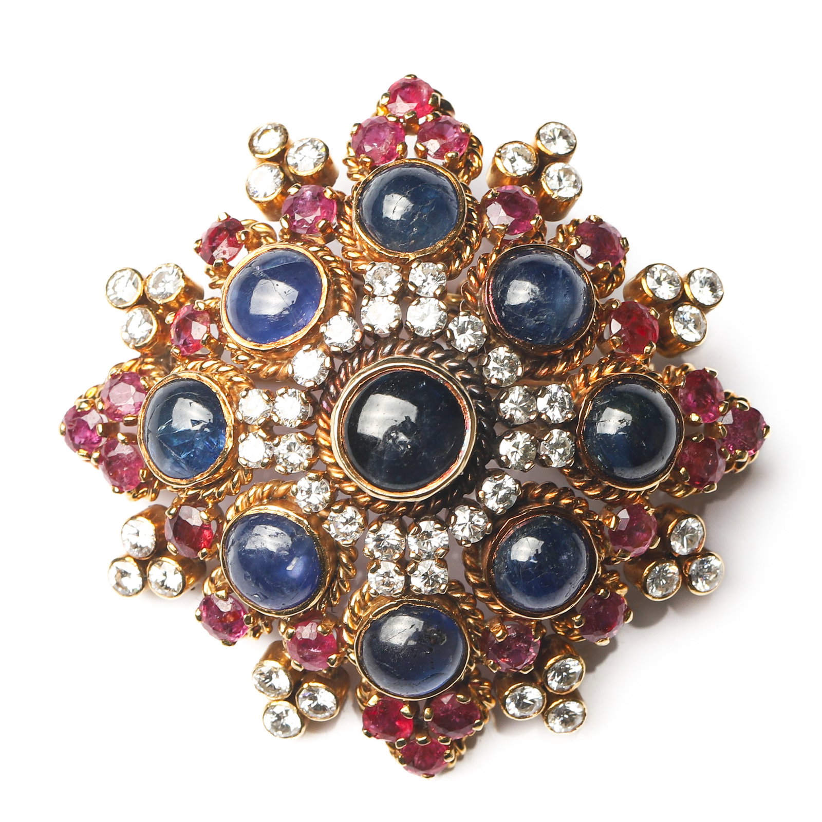 ILIAS LALAOUNIS, A BYZANTINE-STYLE GOLD, SAPPHIRE, RUBY AND DIAMOND BROOCH: Dimensions 1 7/8 × 1 7/8 in. (48 × 48 mm); Weight: 29.3 g Description A magnificent Byzantine-style brooch by renowned Greek jeweler Ilias Lalaounis, crafted in 18K gold. Inspired by the opulence of
