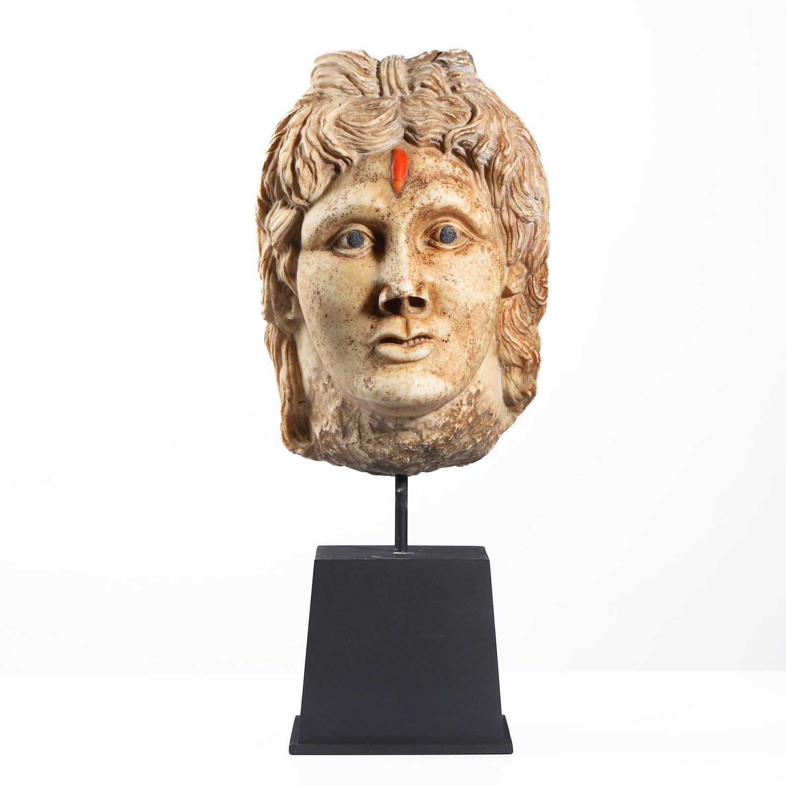 APOLLO, THE SUN GOD, MARBLE HEAD SCULPTURE: Dimensions Overall height (including stand): approx. 17 3/8 in (44 cm) Net height (excluding stand): approx. 10 5/8 in (27 cm) Width: approx. 7 1/2 in (19 cm) Depth: approx. 7 1/2 in (19 cm) Descripti