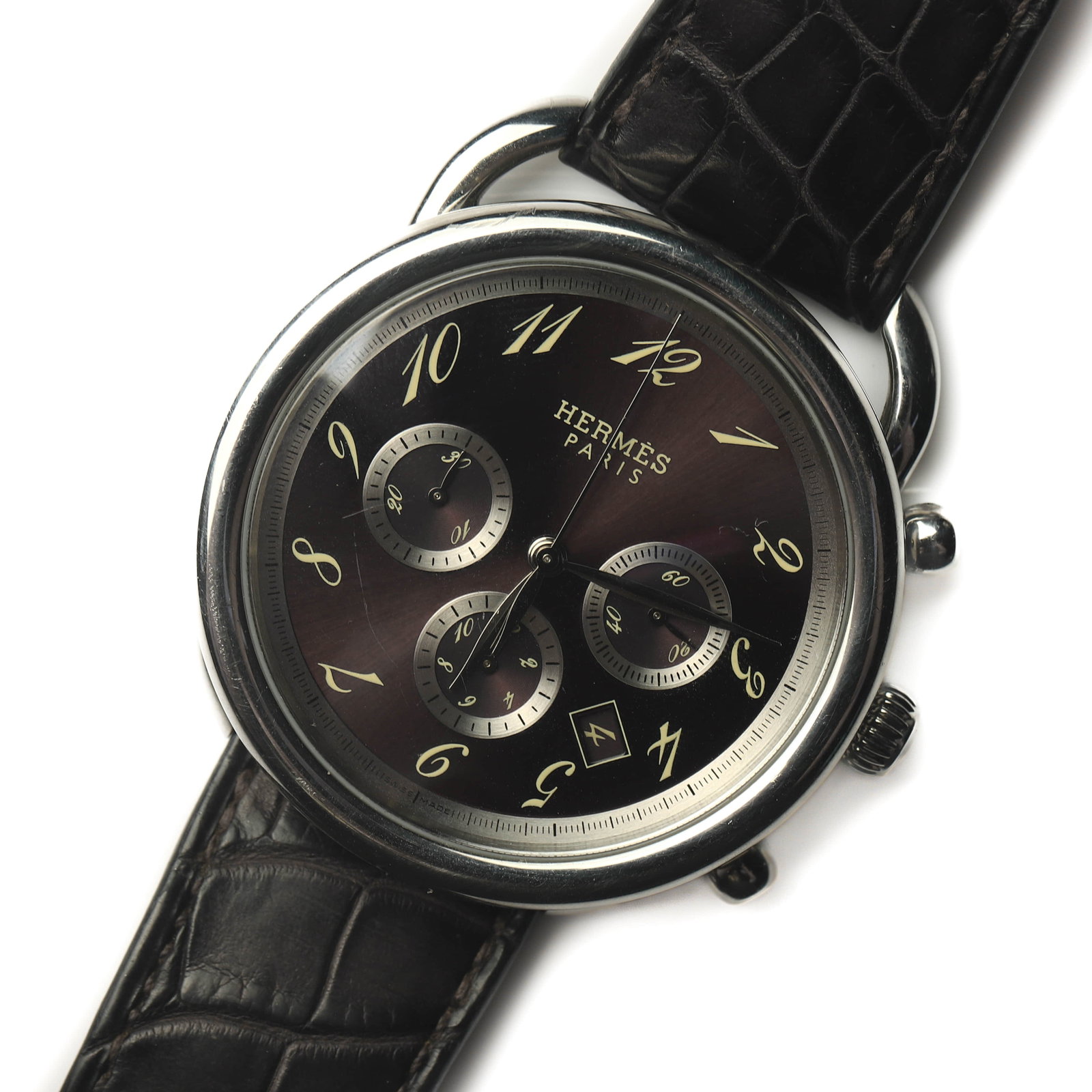 HERMÈS PARIS STAINLESS STEEL CHRONOGRAPH QUARTZ WRISTWATCH: Dimensions Overall Length: 10 3/8 in. (26.4 cm) Case Diameter: 1 7/8 in. (4.72 cm) Weight: 97.7 g Description A Hermès Paris stainless steel chronograph quartz wristwatch, featuring a distinctive