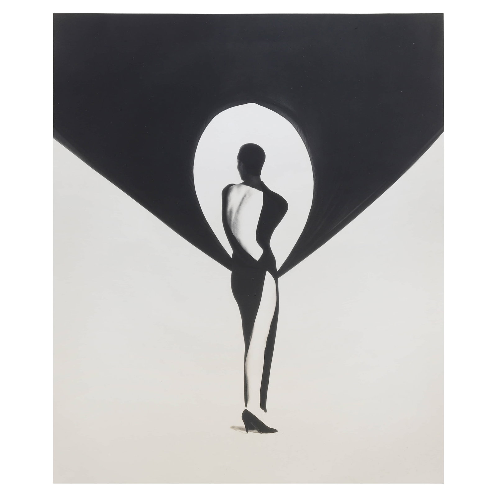HERB RITTS (1952–2002)VERSACE DRESS, BACK VIEW, EL MIRAGE: Artist HERB RITTS (1952–2002) Title VERSACE DRESS, BACK VIEW, EL MIRAGE Medium Silver gelatin print, mounted on board Signature Pencil signed and stamped on verso Dimensions Photograph: 21 1/4 × 17