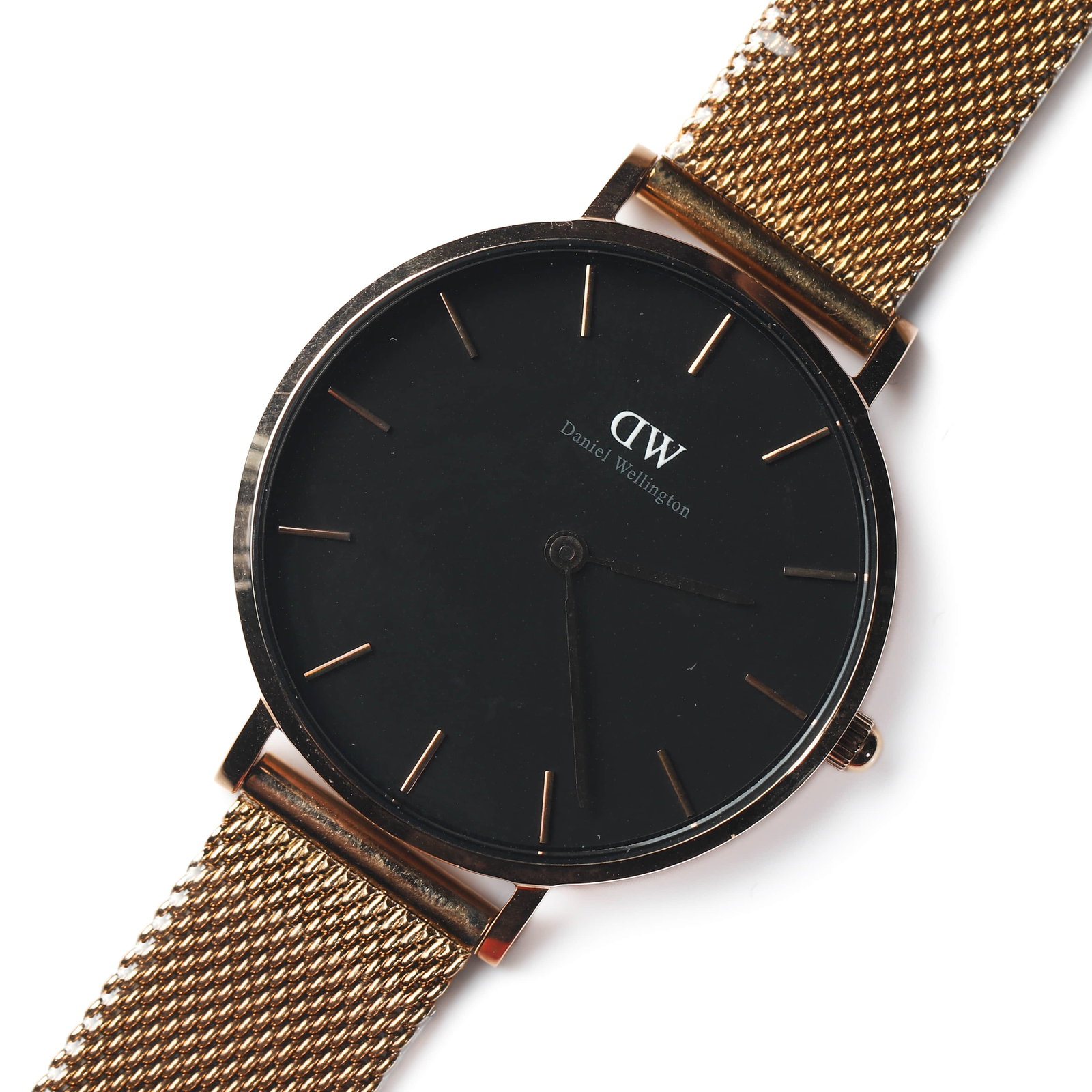 DANIEL WELLINGTON STAINLESS STEEL QUARTZ WRISTWATCH: Dimensions Dial diameter 1 5/16 in. (34.2 mm) Overall length 9 1/16 in. (23 cm) Weight: 41.5 g Description A Daniel Wellington stainless steel quartz wristwatch, featuring a black dial with rose gold-