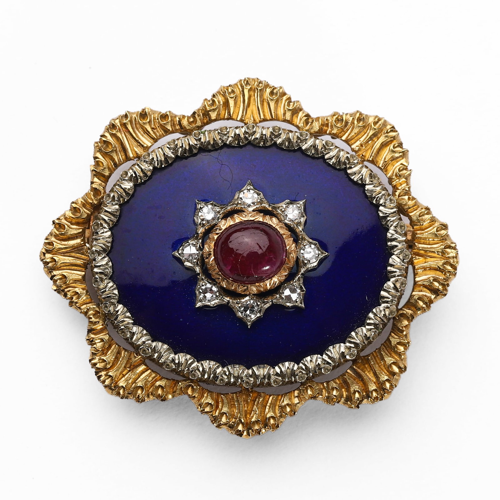 AN ANTIQUE GOLD, ENAMEL, RUBY AND DIAMOND BROOCH, 19TH CENTURY: Dimensions 28.3 Ã— 33.1 mm; central cabochon ruby approx. 5.4 Ã— 4.8 mm; gross weight 14 g. Description Designed as a stylized foliate panel in chased and textured yellow gold, centering an oval
