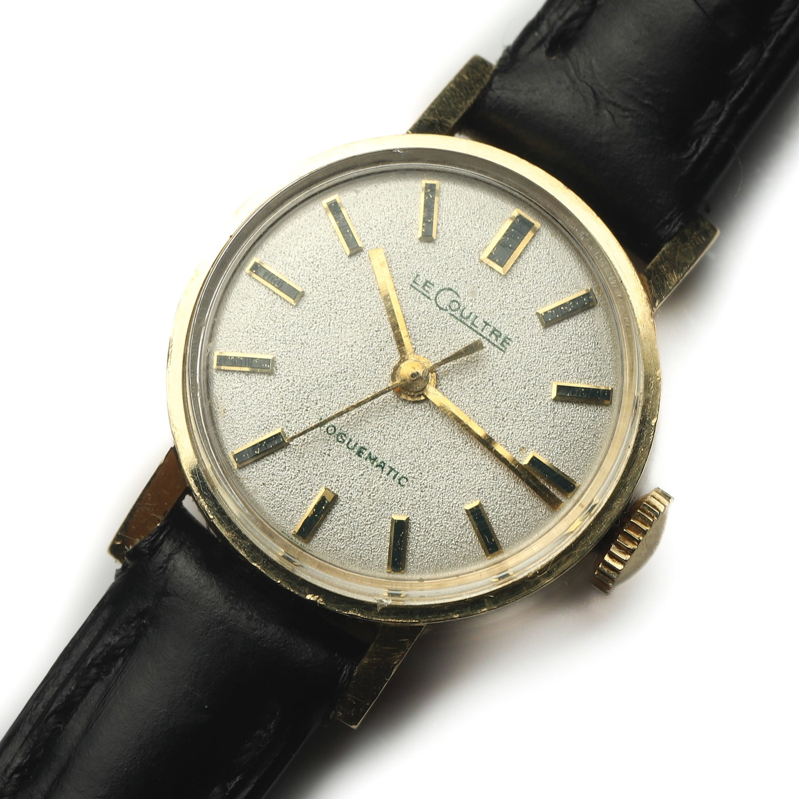 LE COULTRE 14K GOLD AUTOMATIC WRISTWATCH: Dimensions Dial Diameter: 13/16 in. (21.4 mm) Overall Length: 8 in. (20.4 cm) Weight: 14.7 g Description A LeCoultre automatic wristwatch, crafted in 14K yellow gold, featuring a textured silver dial 