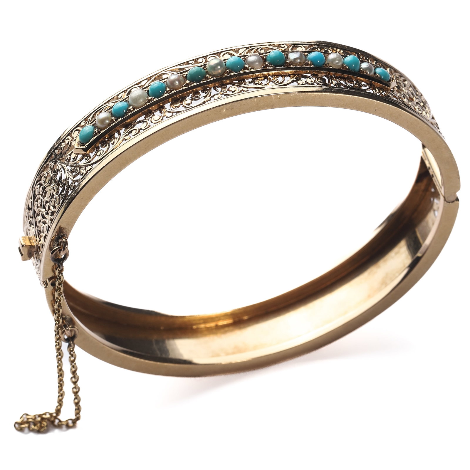 NAPOLEON III PERIOD 18K GOLD OPENWORK NATURAL PEARL AND TURQUOISE BRACELET: Dimensions Inner diameter 1 15/16-2 1/4in. Suitable for wrist circumference up to 6 5/16in. weight 22.1g Description An elegant French Napoleon III-period bracelet, dating circa 1852-1870, finely